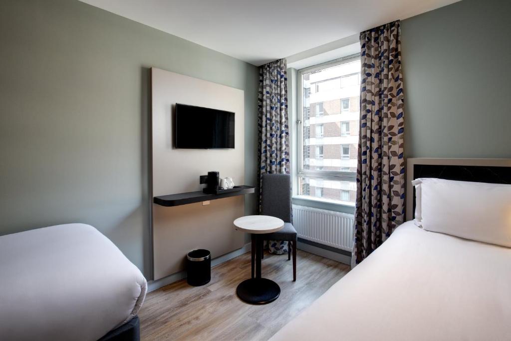 Modern exterior view of The Athenian Callirhoe Exclusive Hotel in Athens, Greece, near the Acropolis — Blyth Academy Travel Italy & Greece student accommodations.