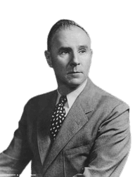 A vintage black-and-white portrait of a distinguished man in a suit and polka-dot tie, captured in a formal pose. The image reflects mid-20th-century fashion and professional style, evoking a classic, timeless appearance suitable for historical or biographical contexts.