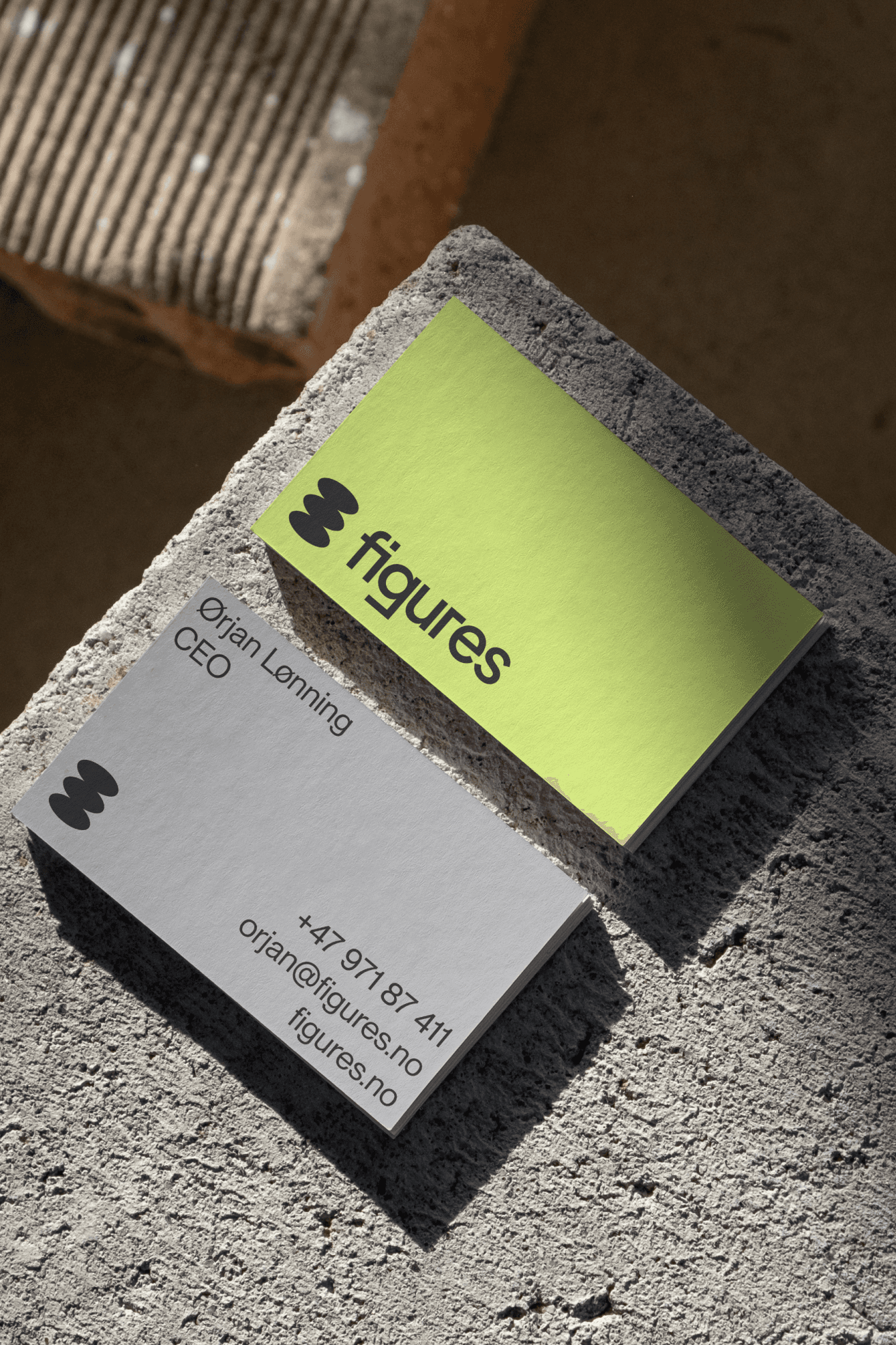 Image of Figures business cards displaying contact information and logo.