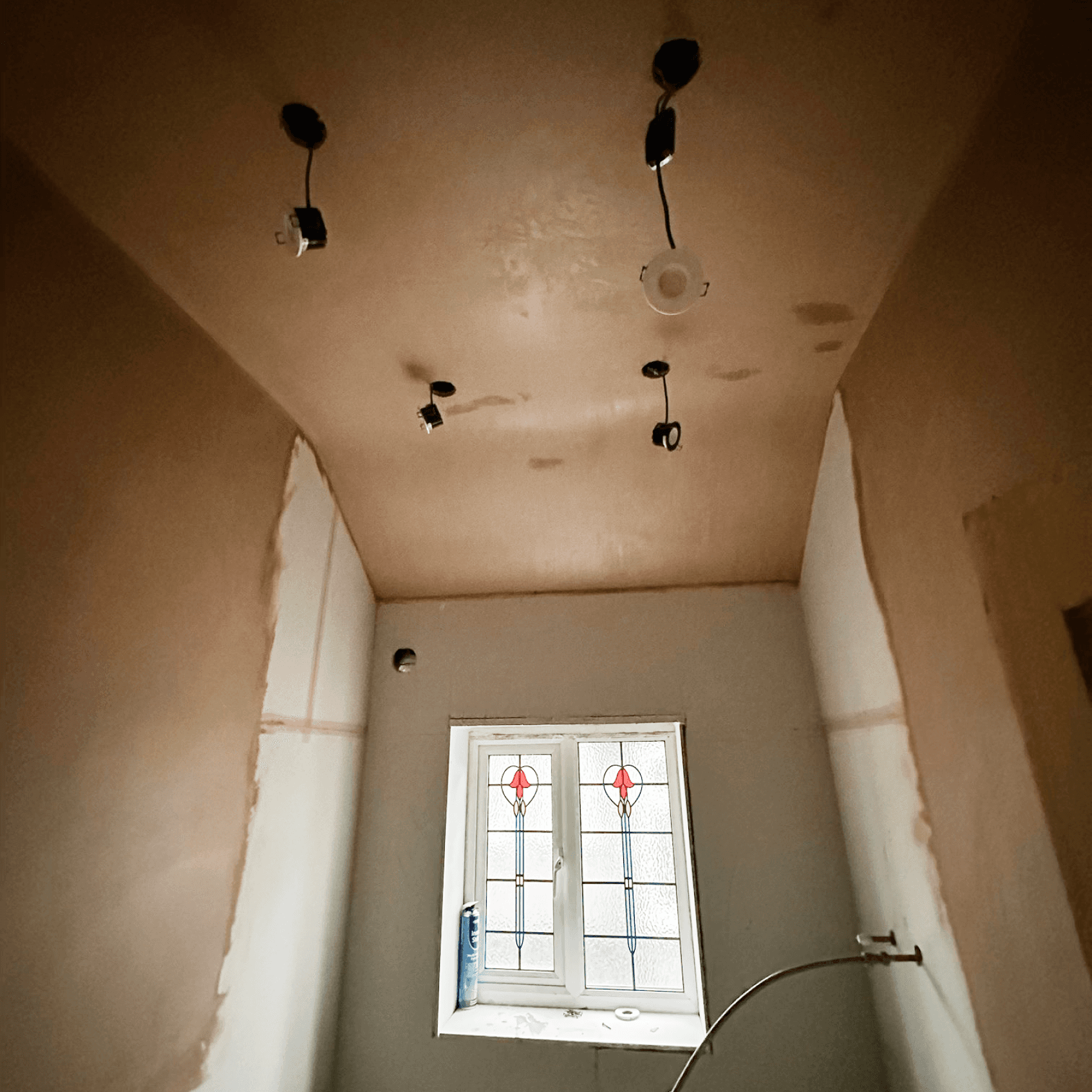 Vaulted ceiling and walls plastered.