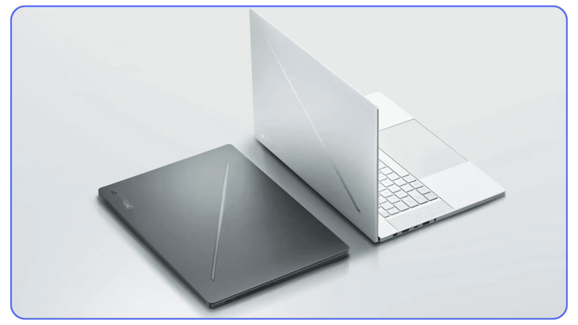 Two ASUS ROG Zephyrus laptops in silver and black colors side by side