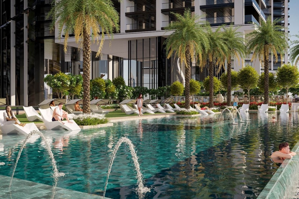The Mirage at Sobha Central, surrounded by the tallest buildings in the world, under a bright sky.