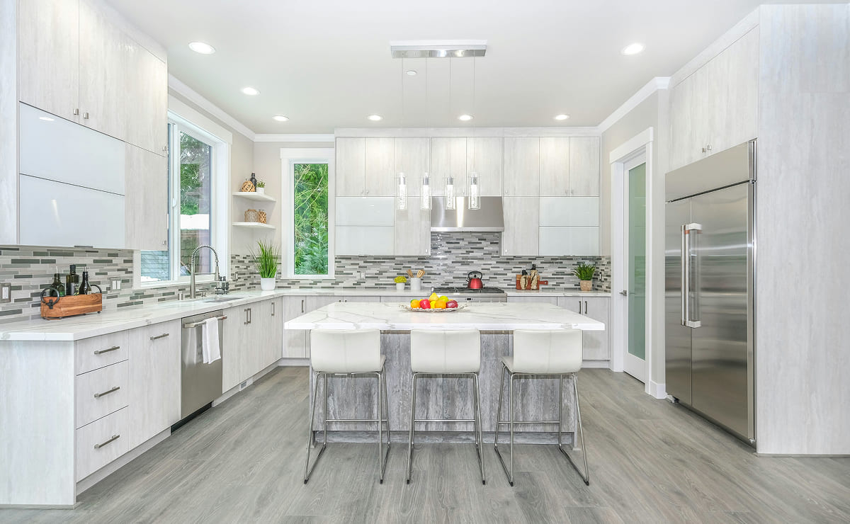 White kitchen with grey floor.