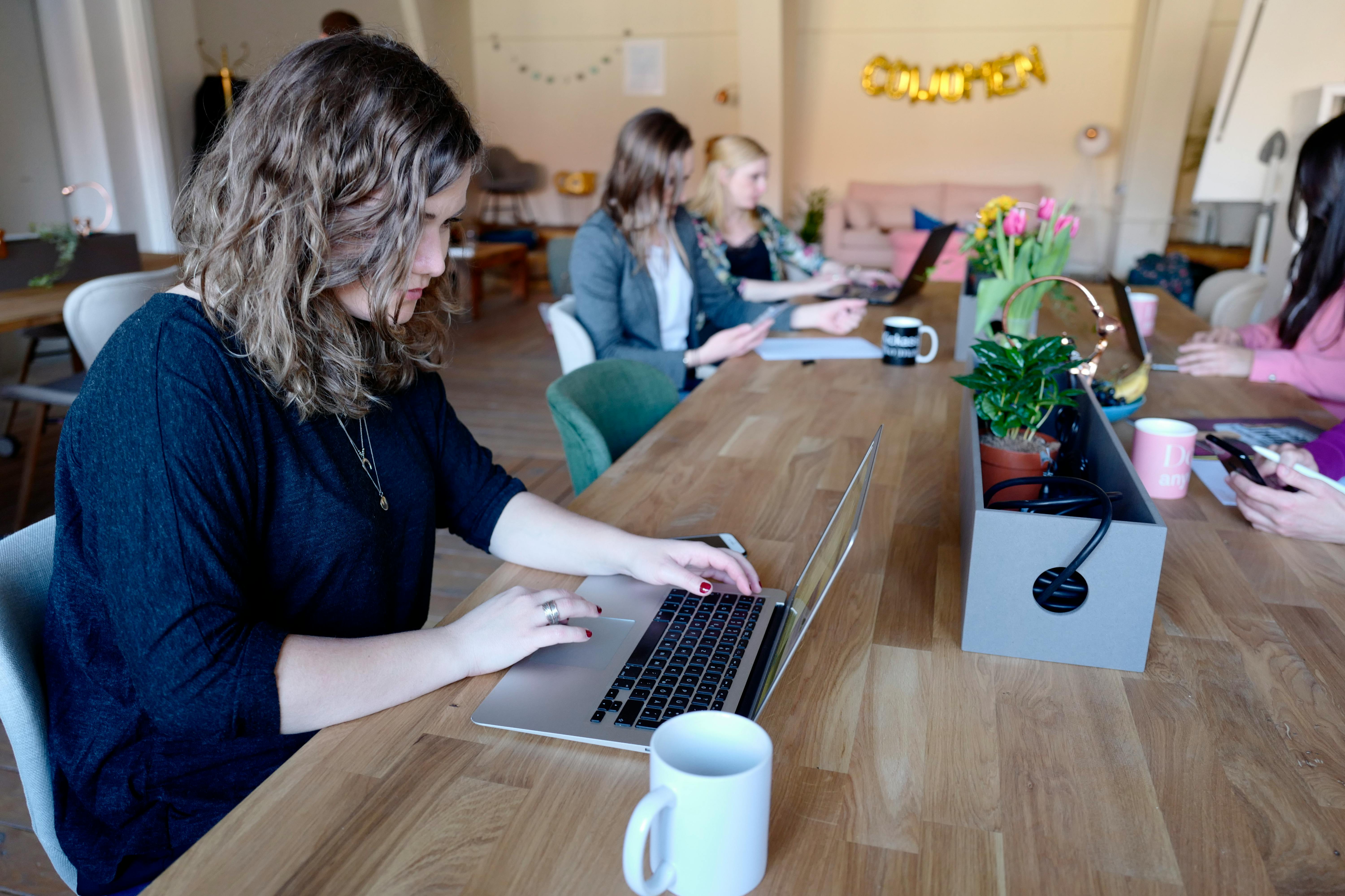 Team members looking at each other inside meeting room
