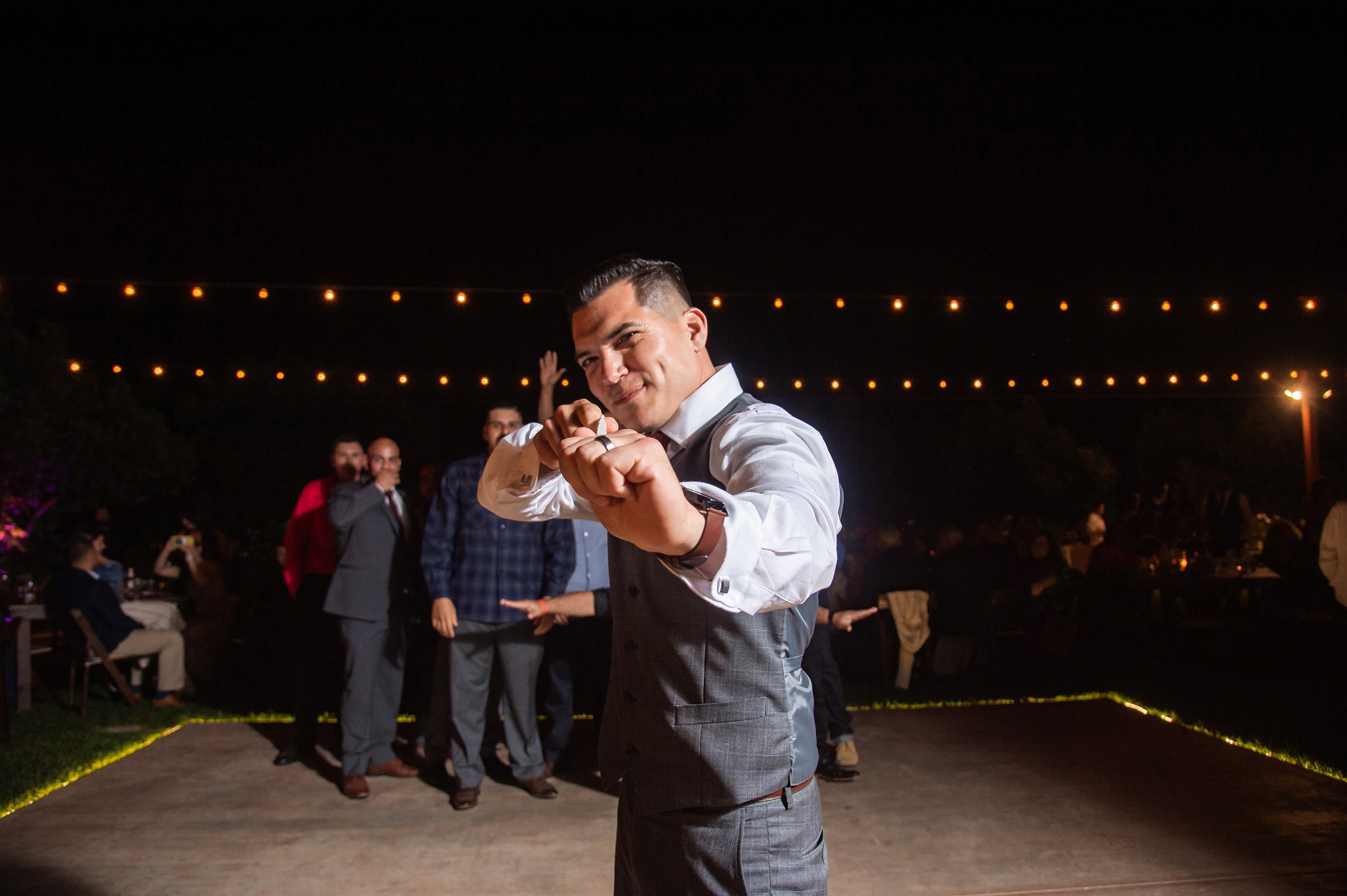 Flat lay wedding details with bouquet, rings, and sparkling bridal heels