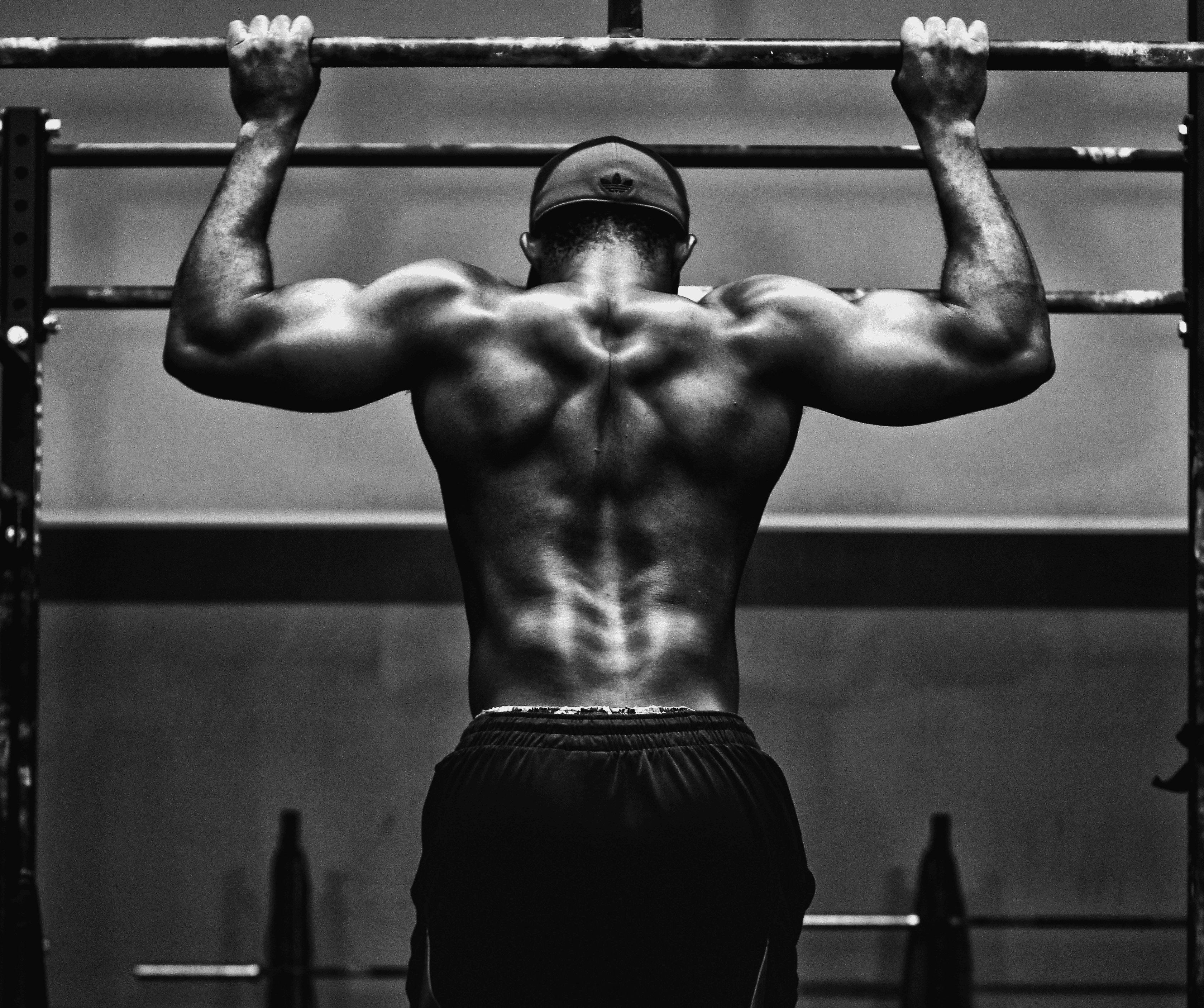 grayscale photo of man working out