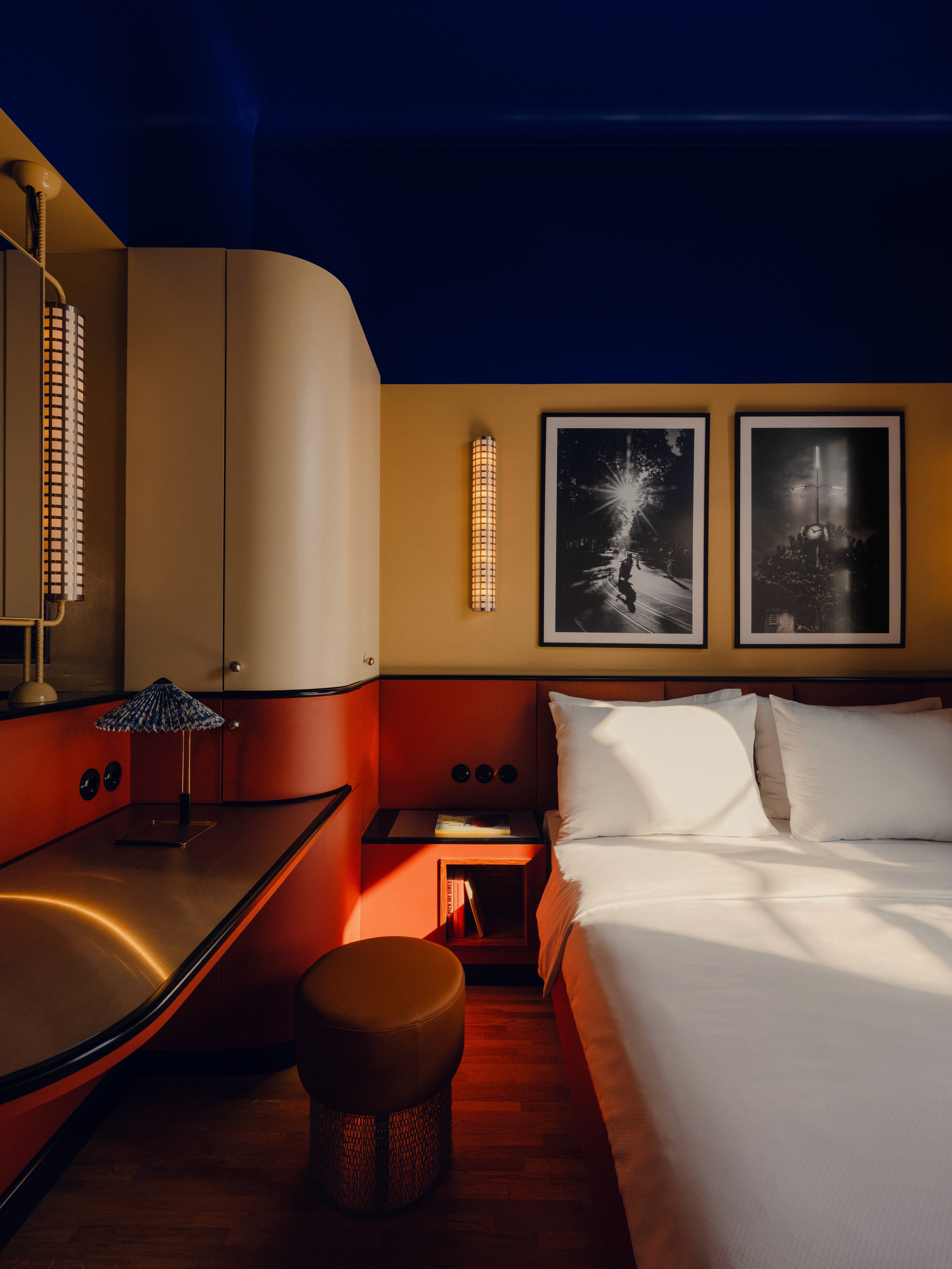 View of bed with cleanly organized pillows in The Companion Hotel