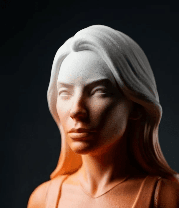 A 3D character viewed from behind with pastel pink hair styled in two buns, wearing a blue knitted sweater and hoop earrings on a light gray background.