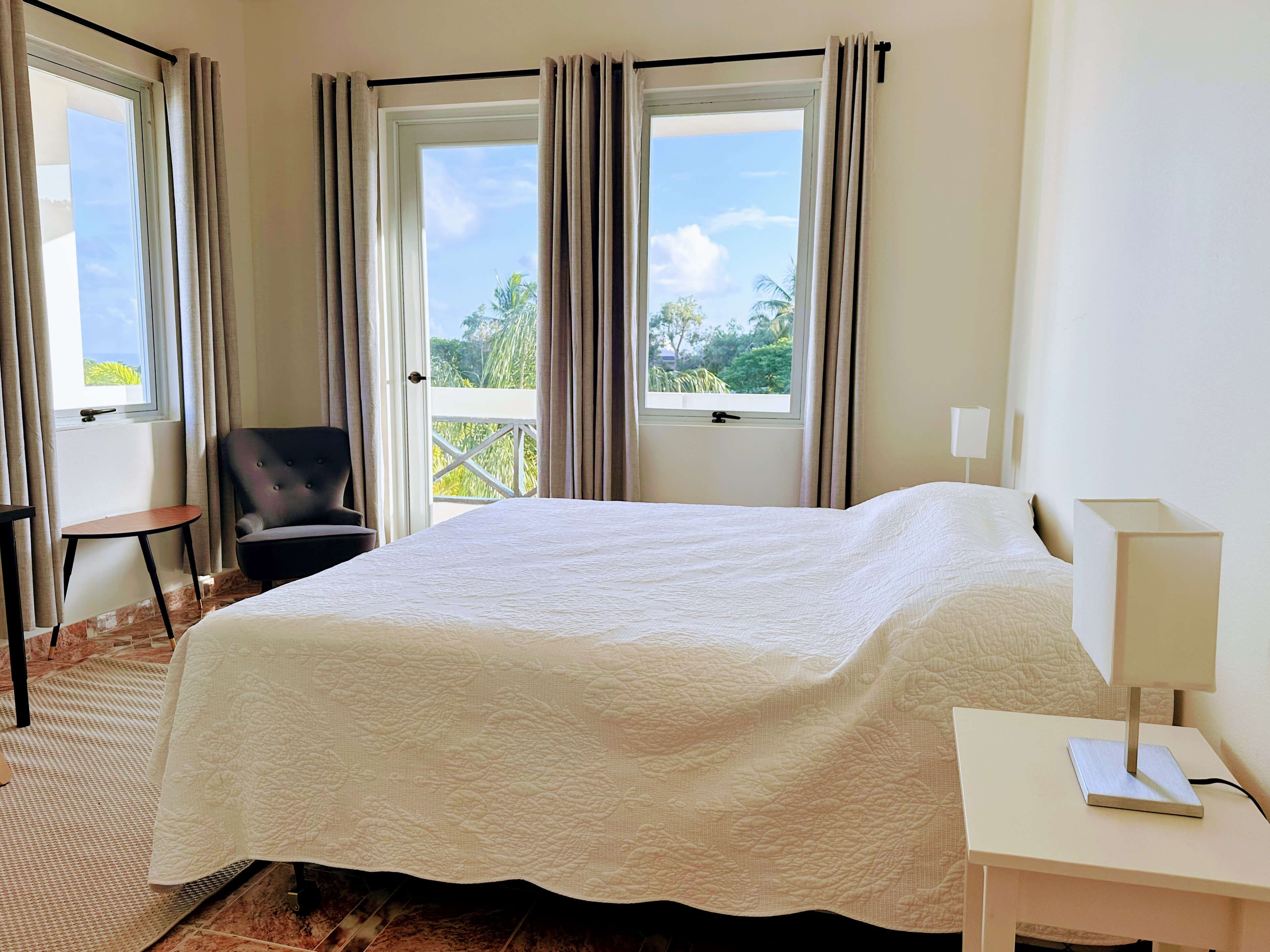 King bed with expansive tropical views from Club Vieques Room 10