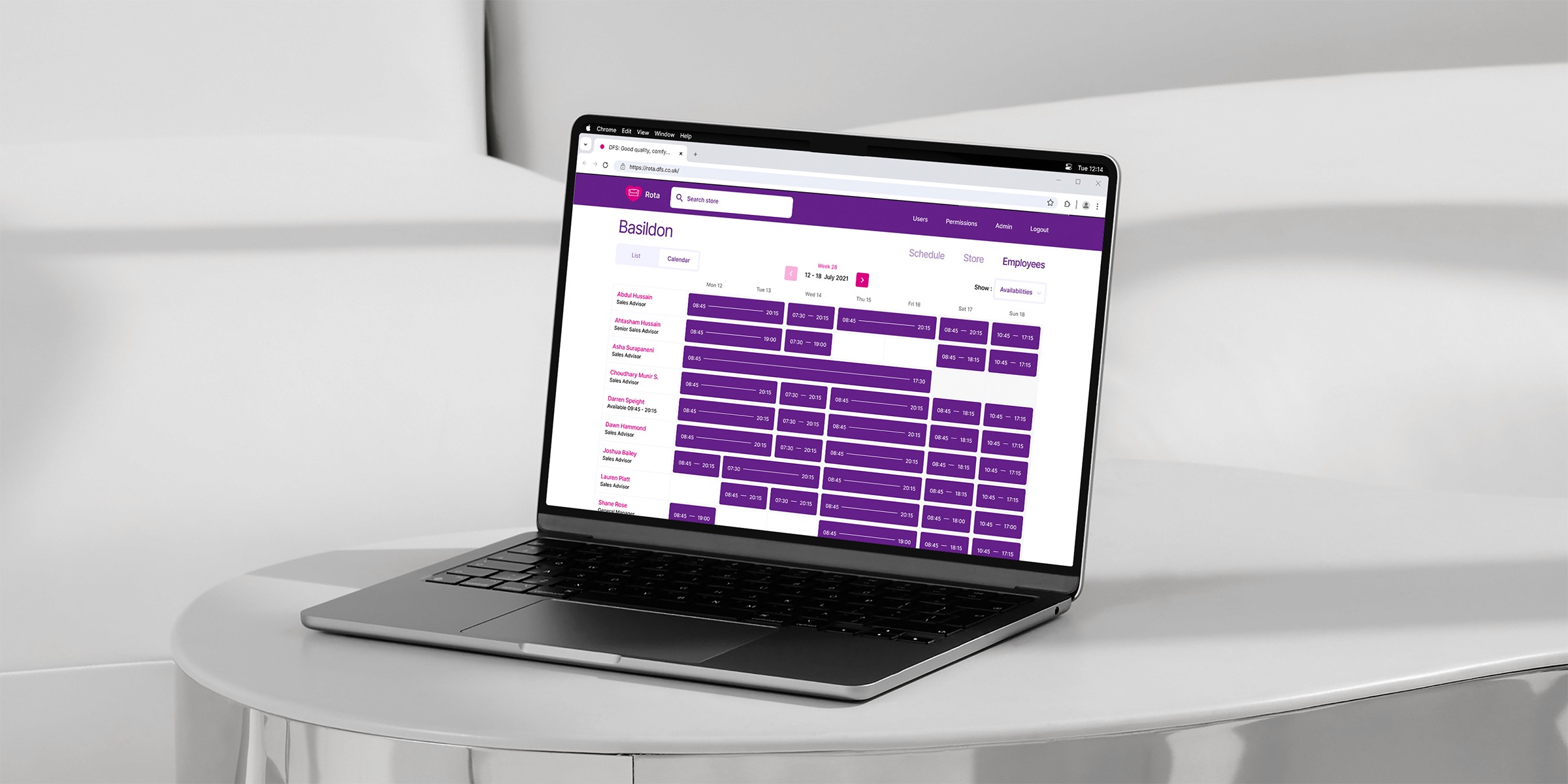 A sleek laptop displaying a vibrant purple digital dashboard provides insights into workforce management for DFS, surrounded by a minimalist white setting.