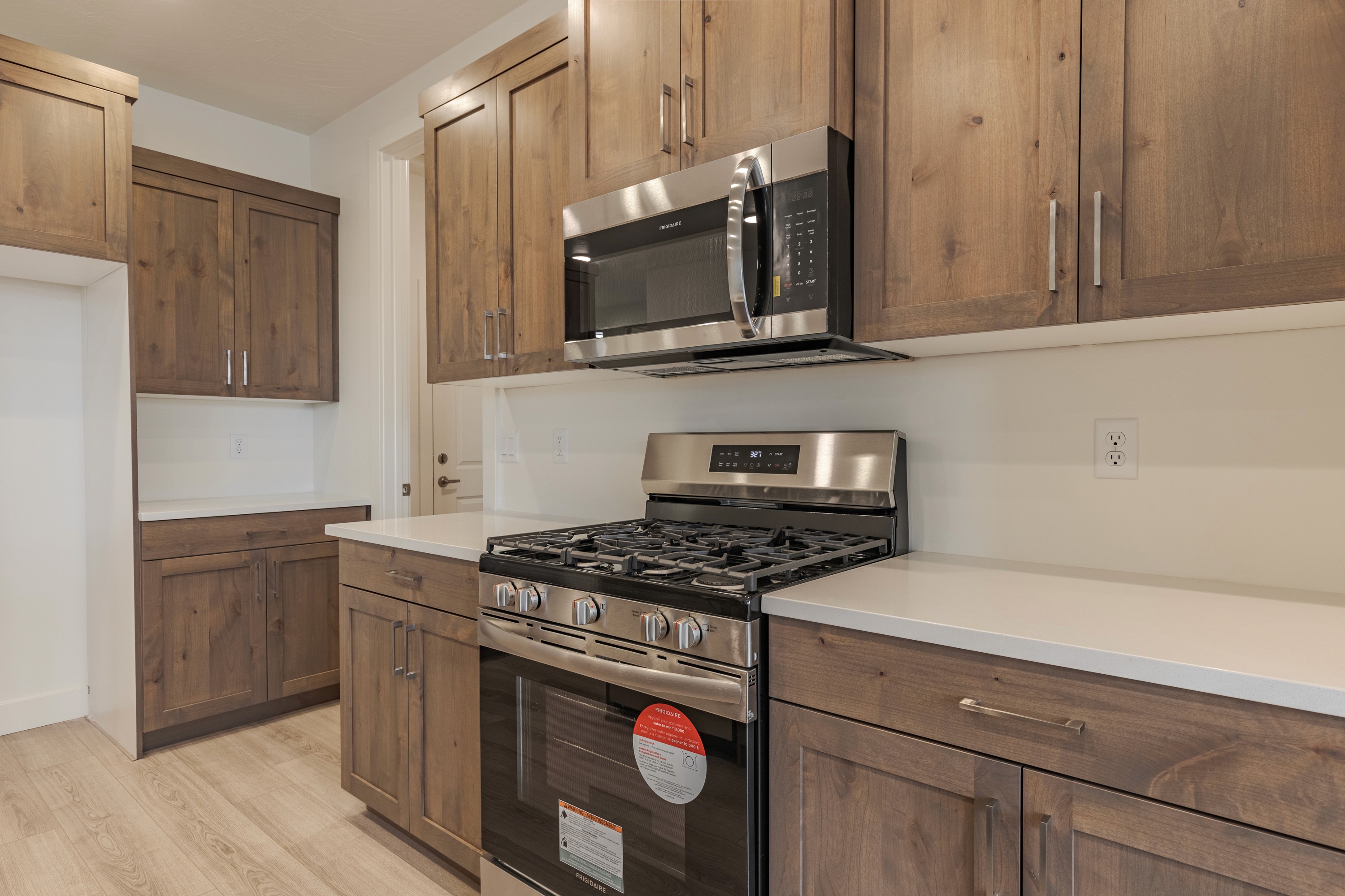 Kitchen view in the Painted Sands twin home in Hurricane, Utah highlighting workflow and light finishes.