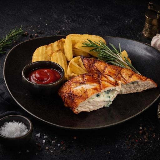 a white plate topped with meat covered in sauce