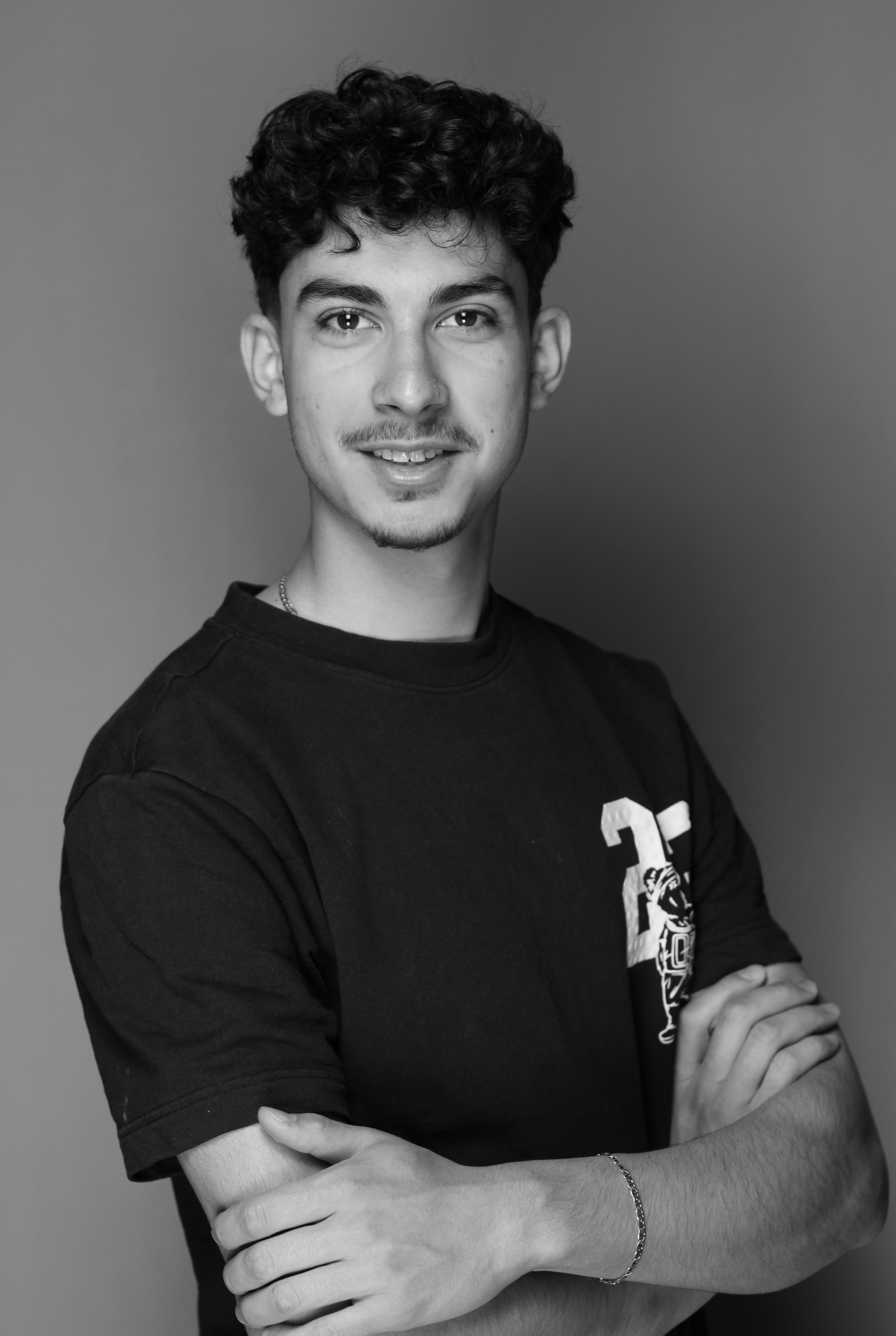 a woman with an afro is looking at the camera