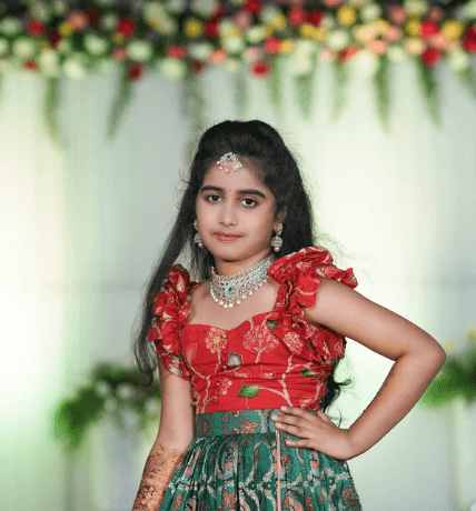 Several glowing blue jellyfish swim in dark water.