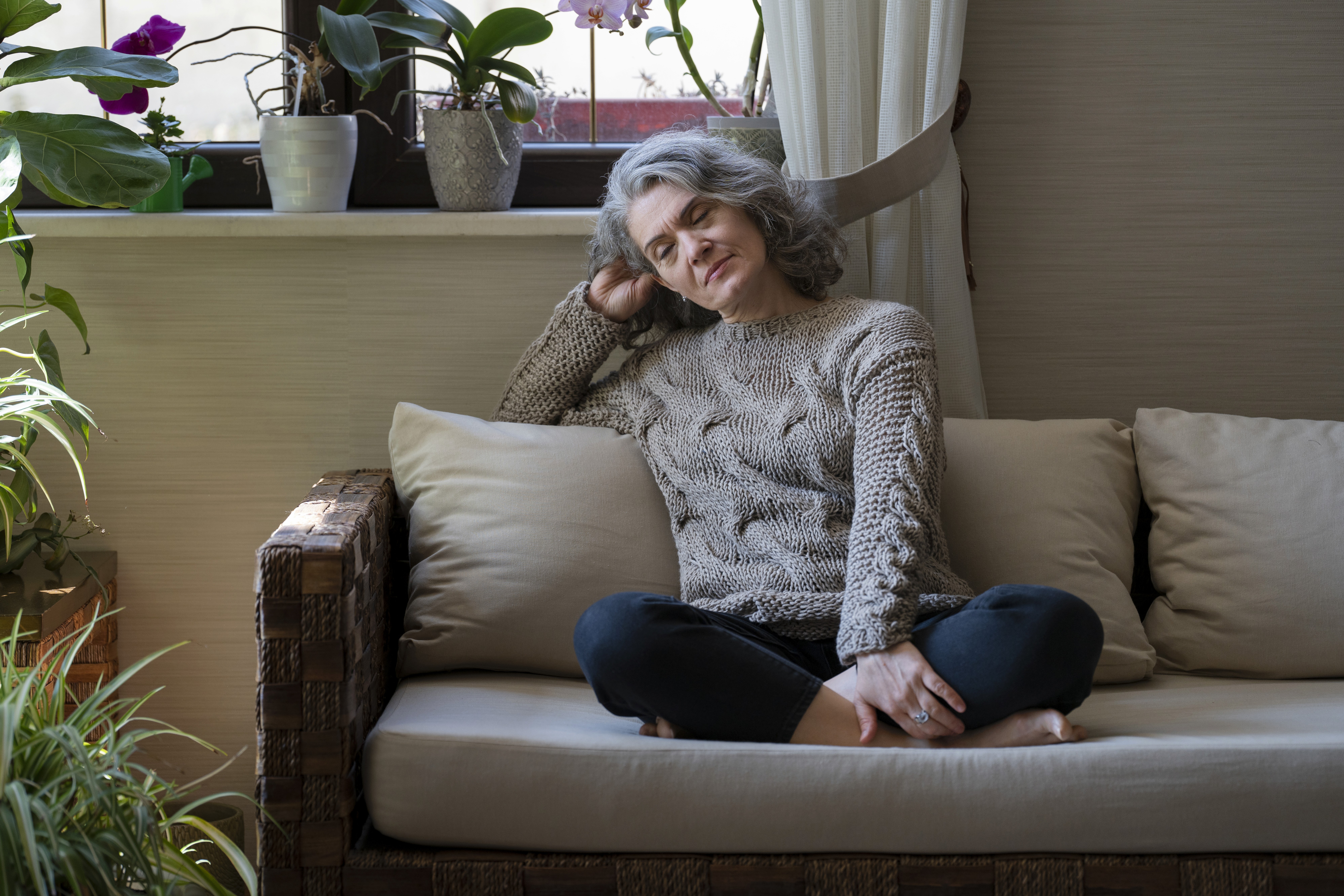 Women at home cleaning up looking at her hands