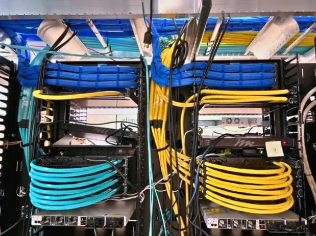 Network cabling and server rack setup inspected during IT site survey