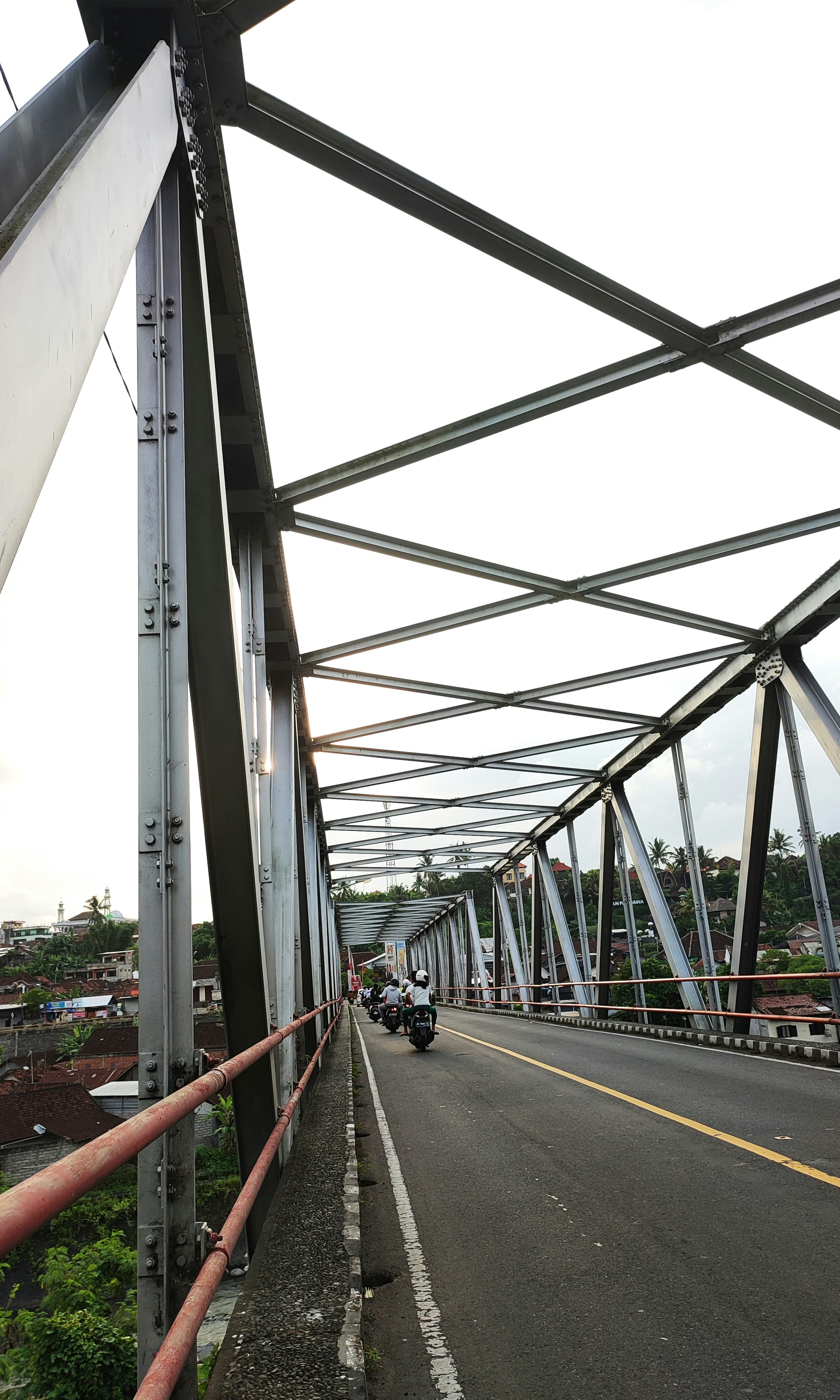A view of a bridge with cars driving on it