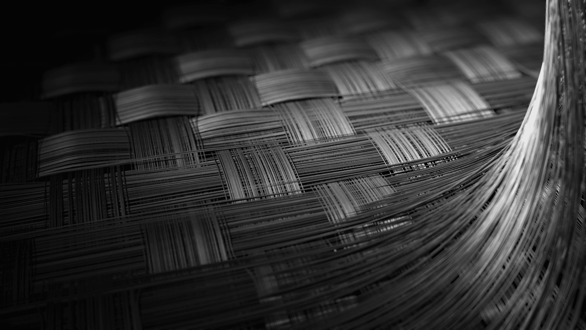 Close-up of a woven carbon fiber texture used in lightweight, high-performance drone construction.