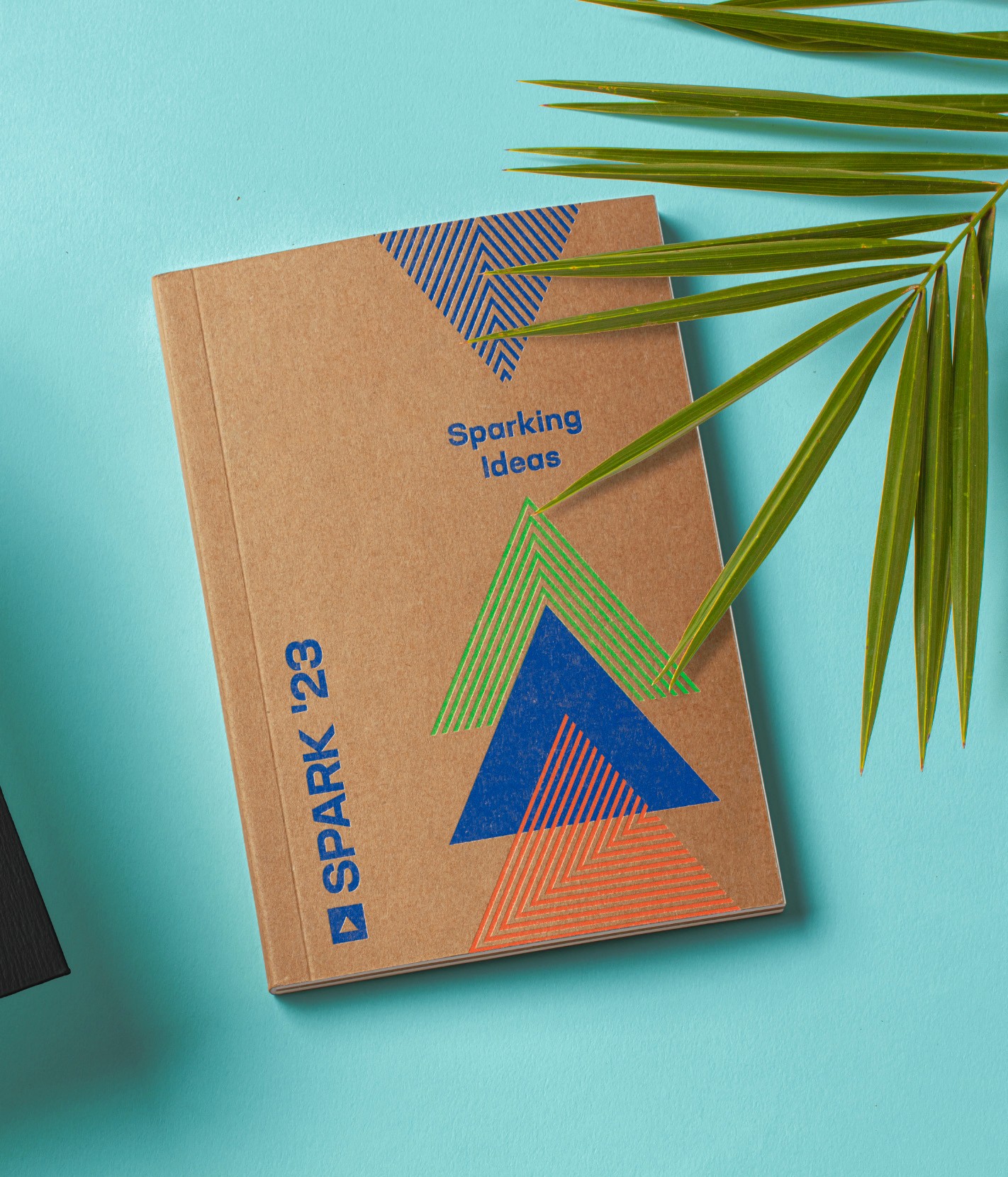 Image of a notebook with SPARK branding and the words "Sparking Ideas."