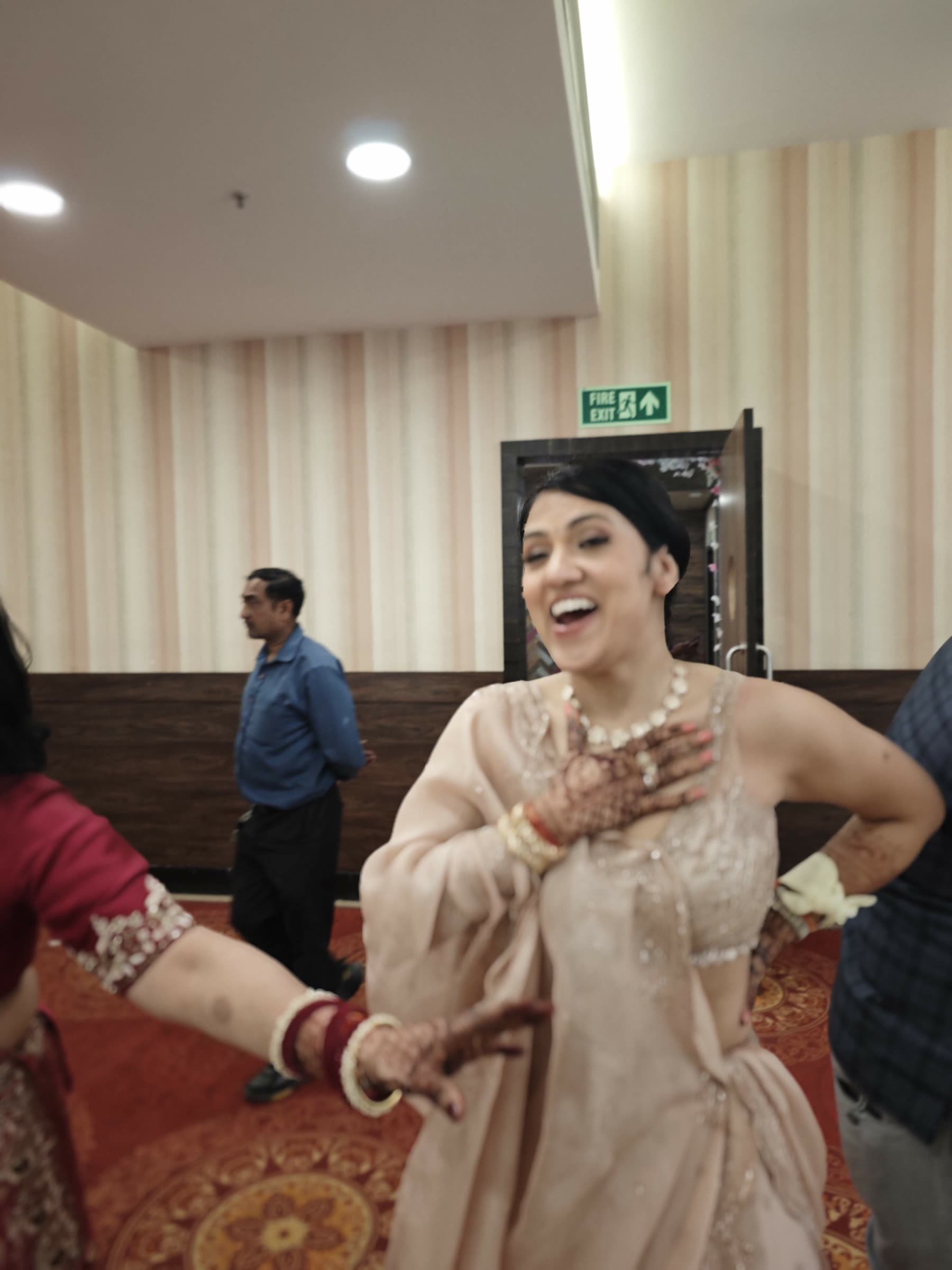 Woman laughing and dancing at the wedding