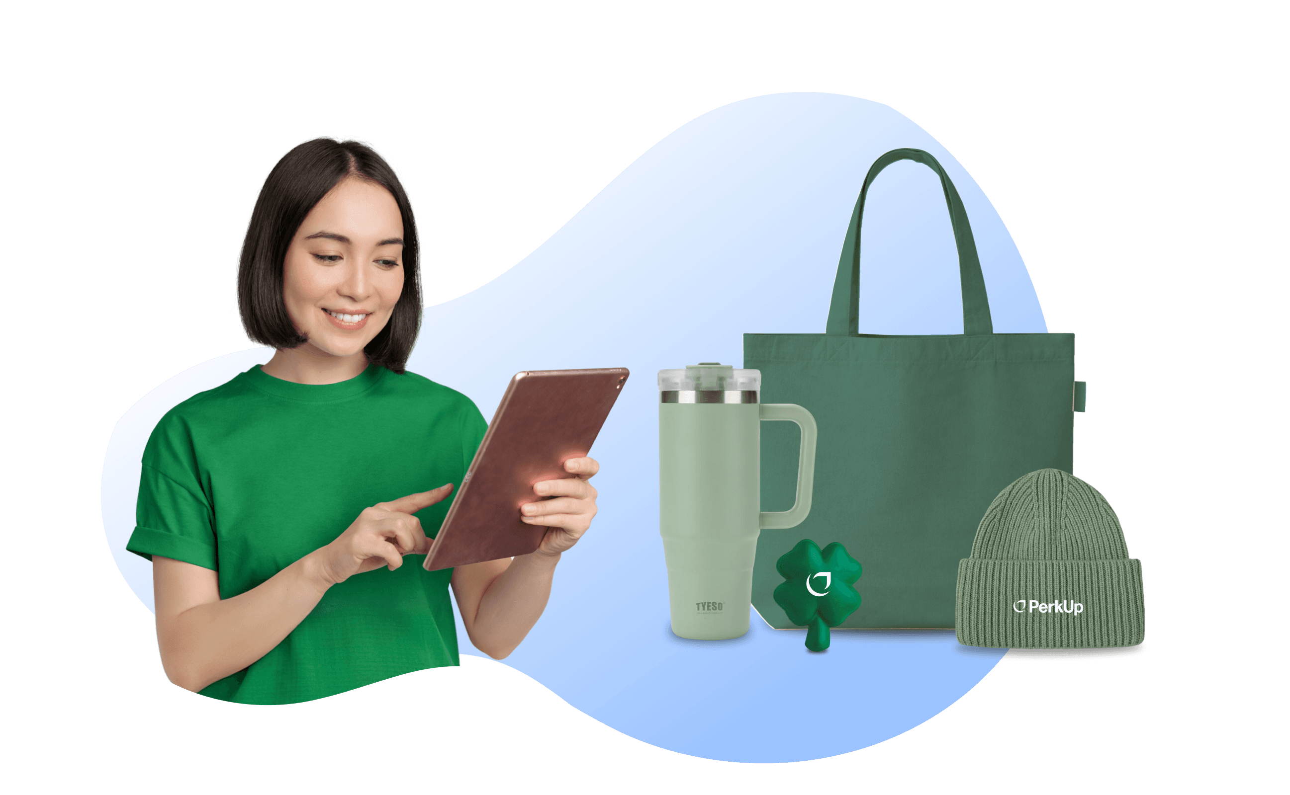 A woman holding a tablet. Beside here, there are a green tumbler, tote bag, and beanie.