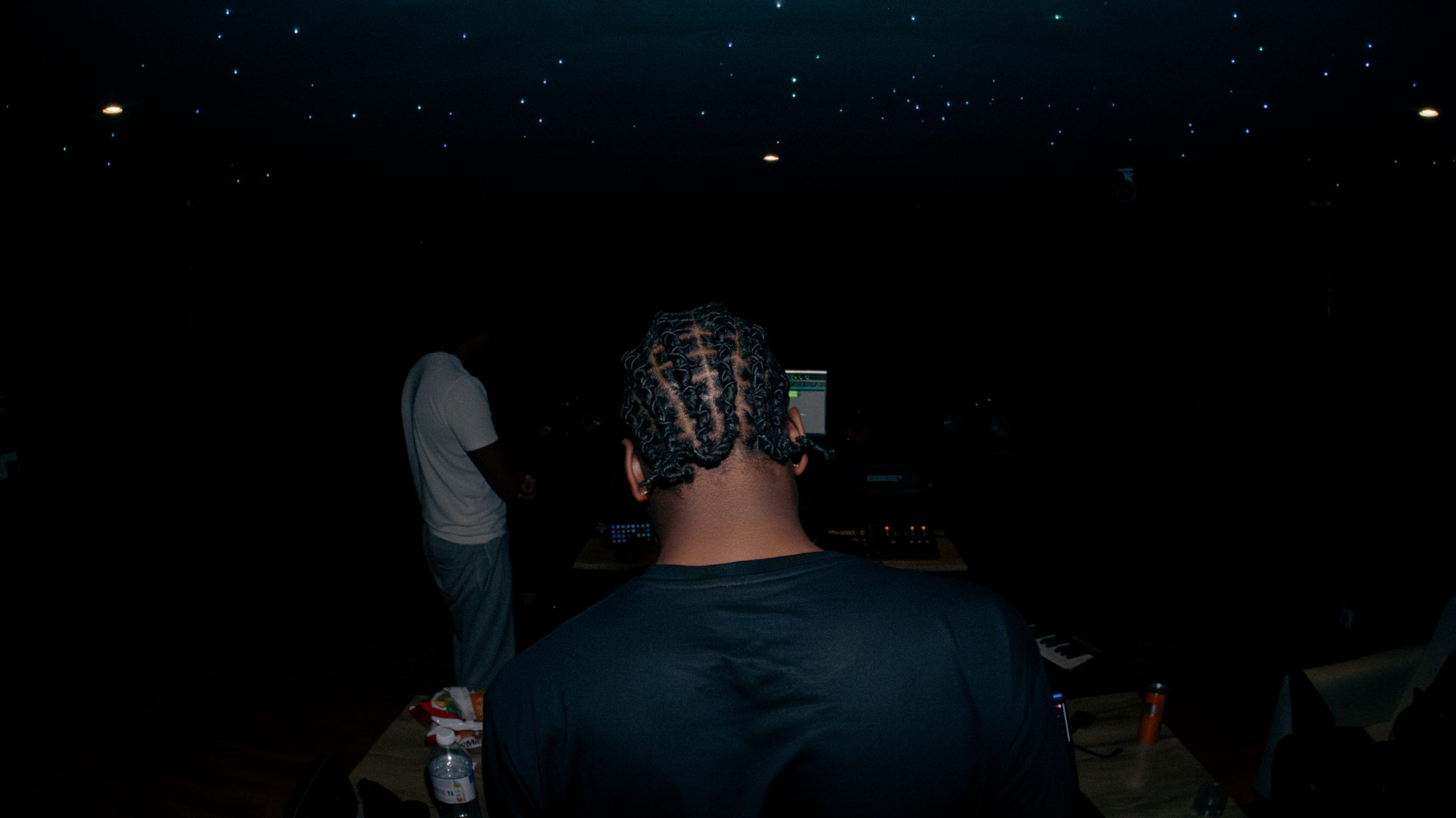 Music producer sitting in his studio