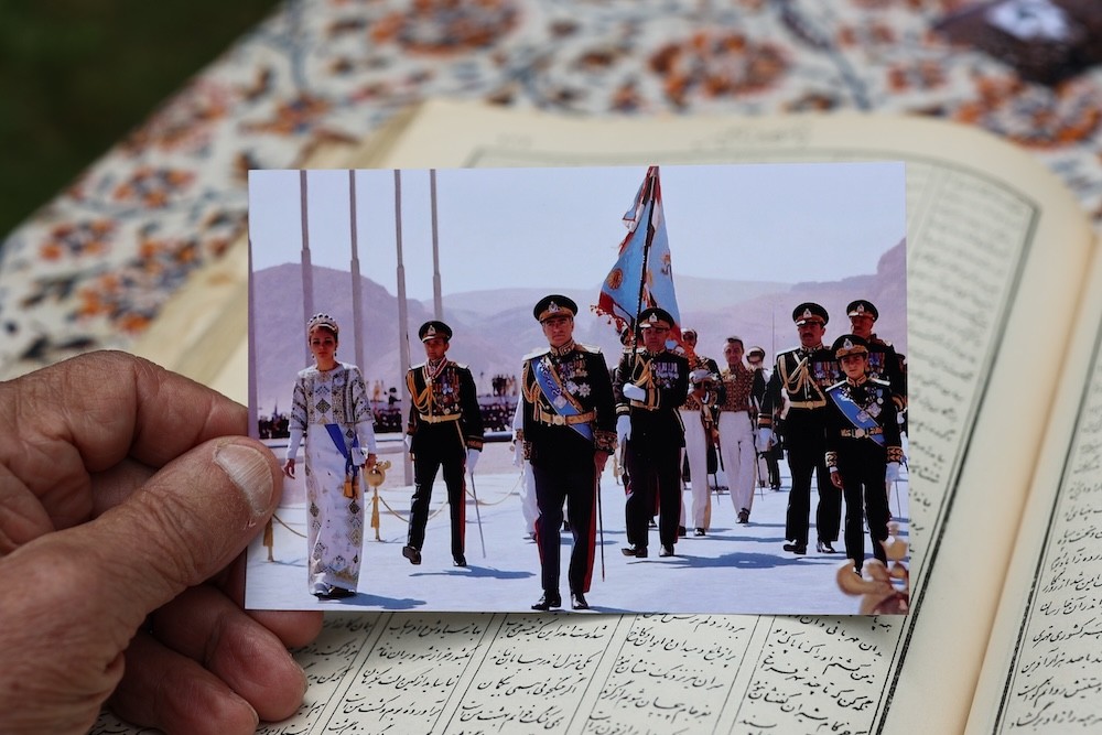 Bubjan with book and speaking to camera