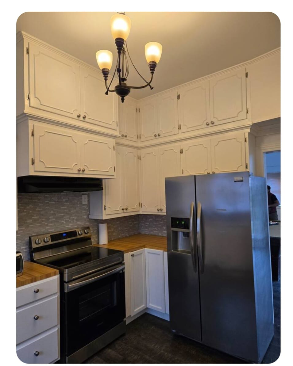 kitchen with two brown wooden chairs