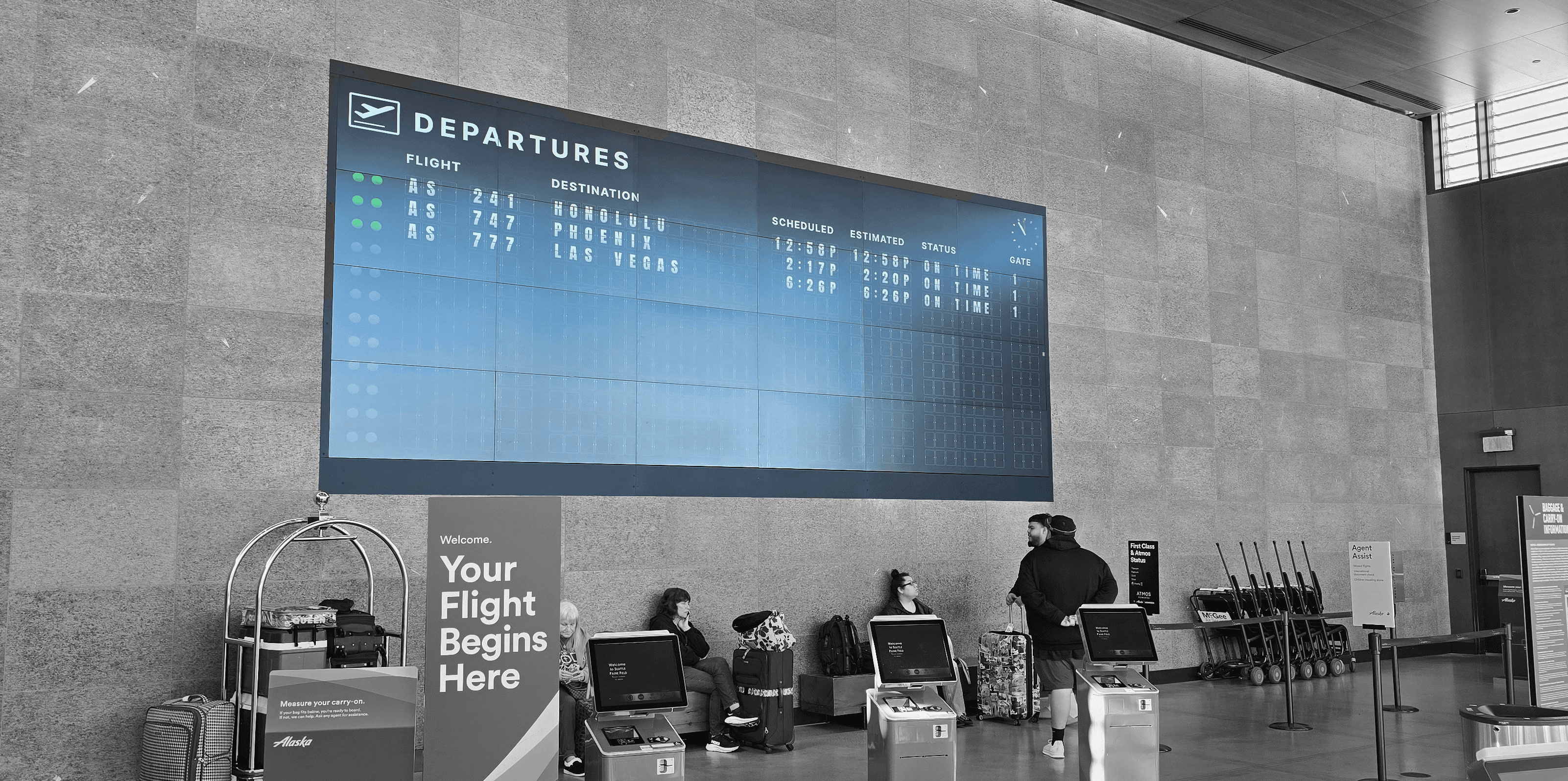 A photo of a digital flap board at Paine Field Airport