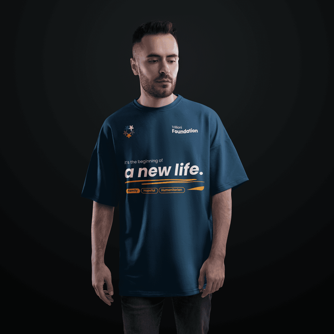 Trillioni Foundation branded t-shirt with slogan ‘It’s the beginning of a new life,’ symbolizing hope, family, and humanitarian empowerment in Chad.