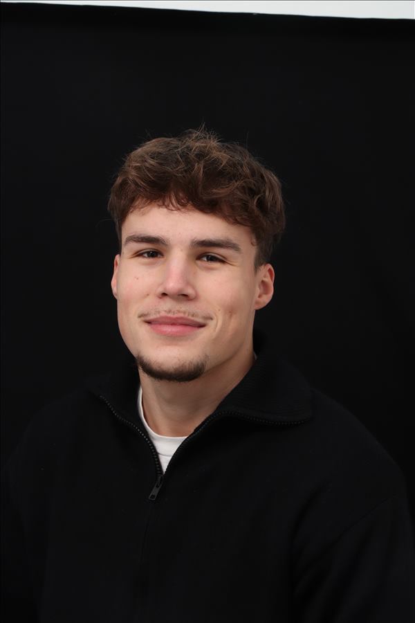 person sitting in a chair in front of a man