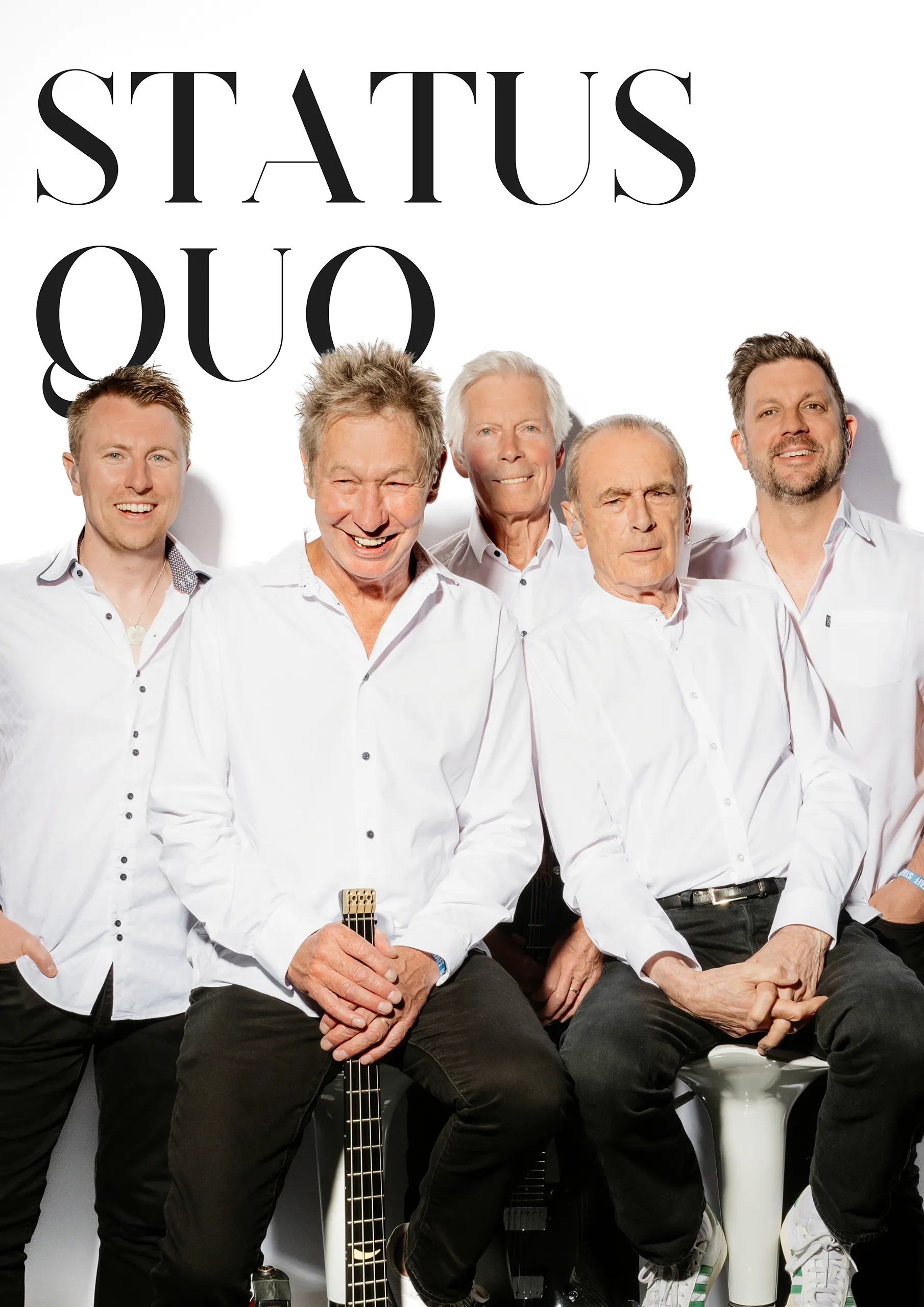 Professional group portrait of the band Status Quo on a clean white background.