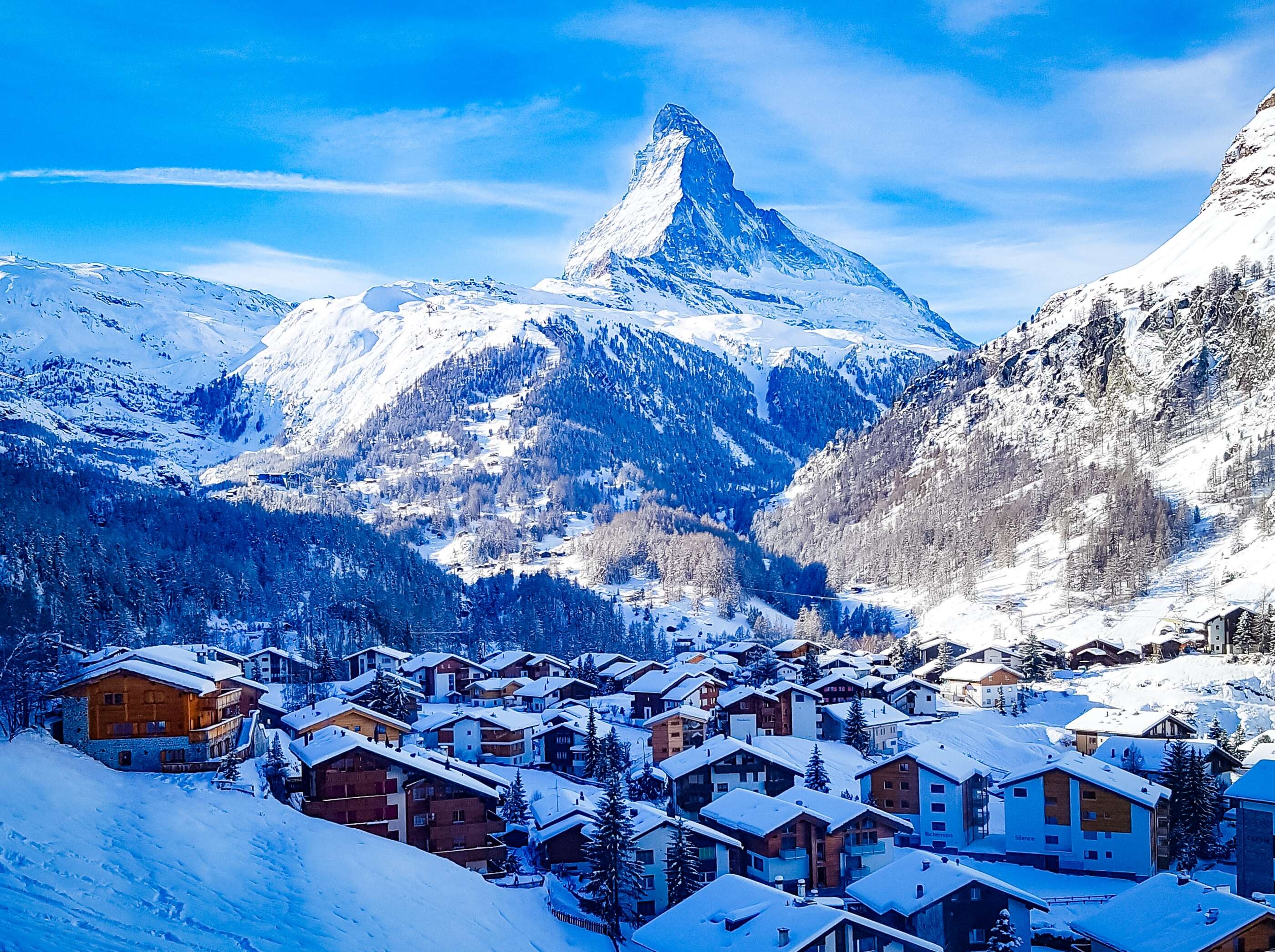 Winter view of Zermatt village beneath the Matterhorn, reflecting enduring structure, stability, and long term wealth continuity.