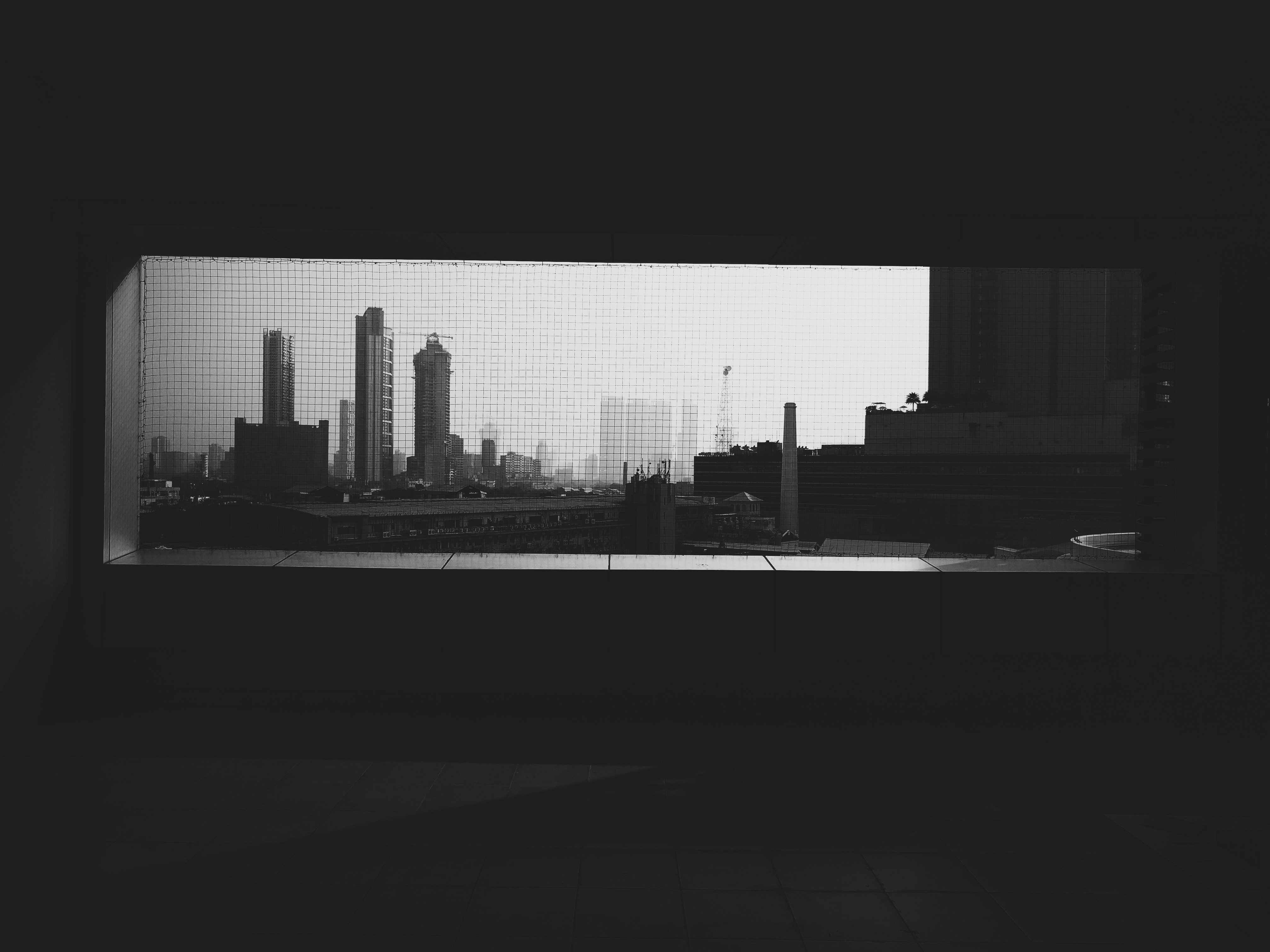grayscale photo of highrise city buildings