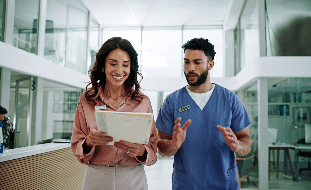 Healthcare professionals discussing file