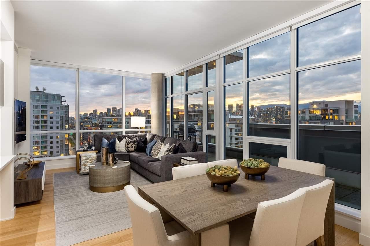 A modern, bright living room with large windows, city views, and contemporary furniture. Cozy and inviting atmosphere.