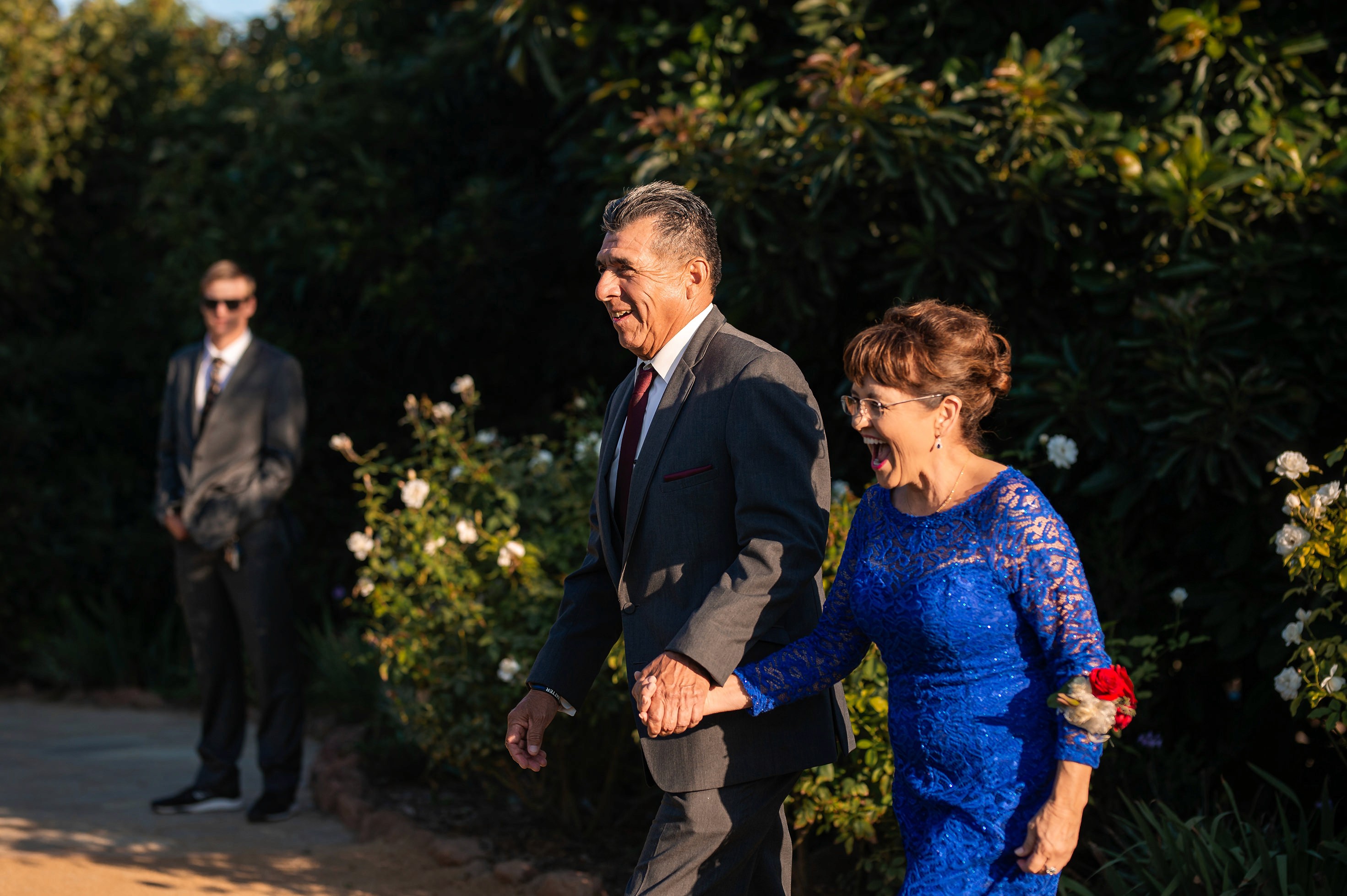 Flat lay wedding details with bouquet, rings, and sparkling bridal heels