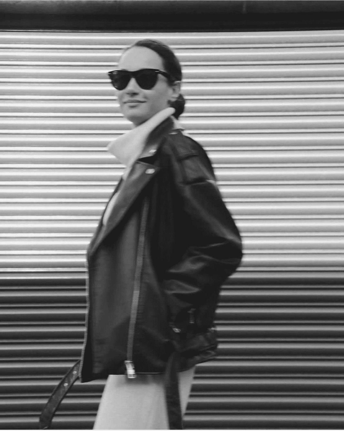 a blurry photo of a person standing in front of a wall