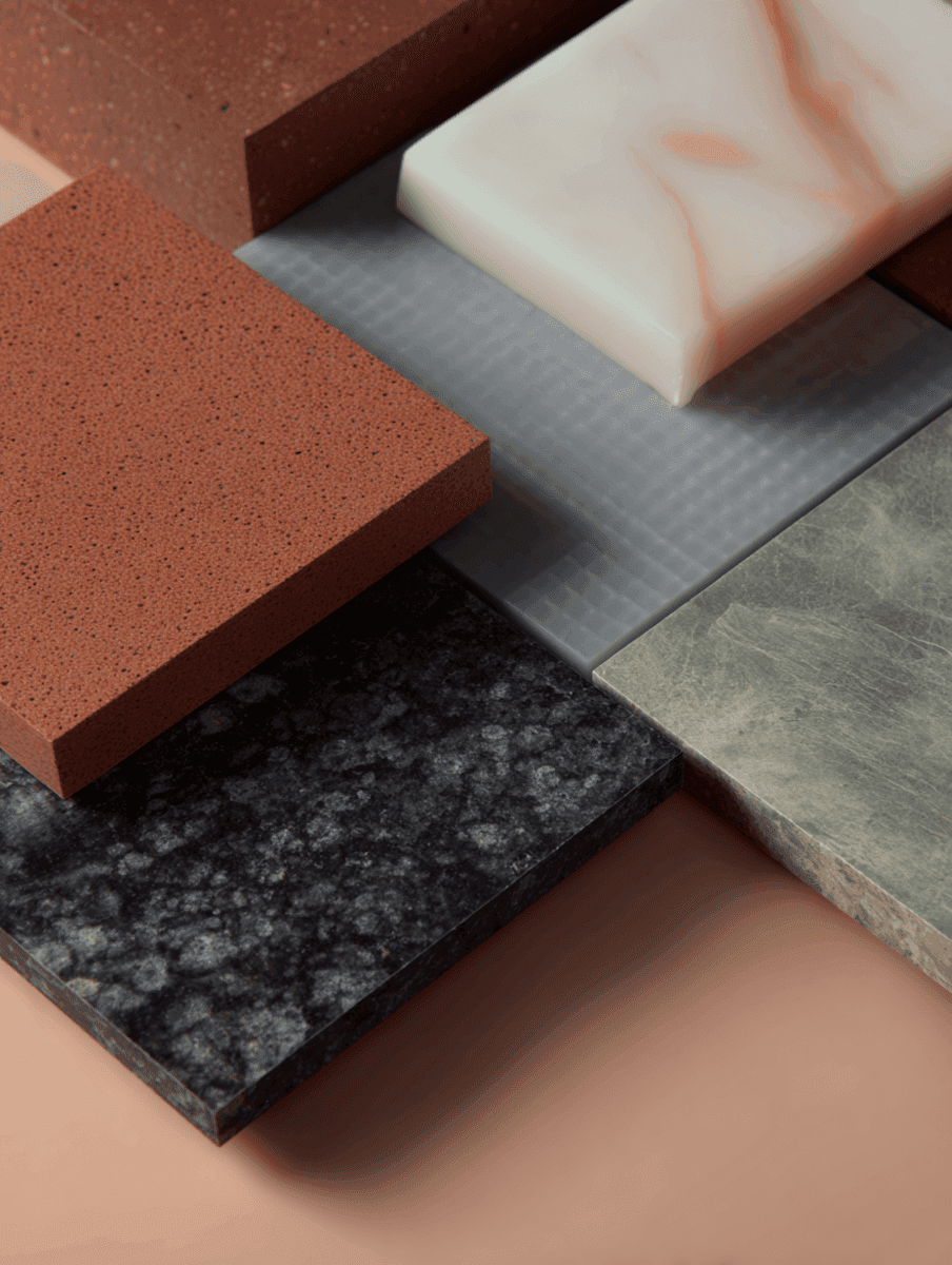 Close-up of terracotta, metal and stone material samples arranged together