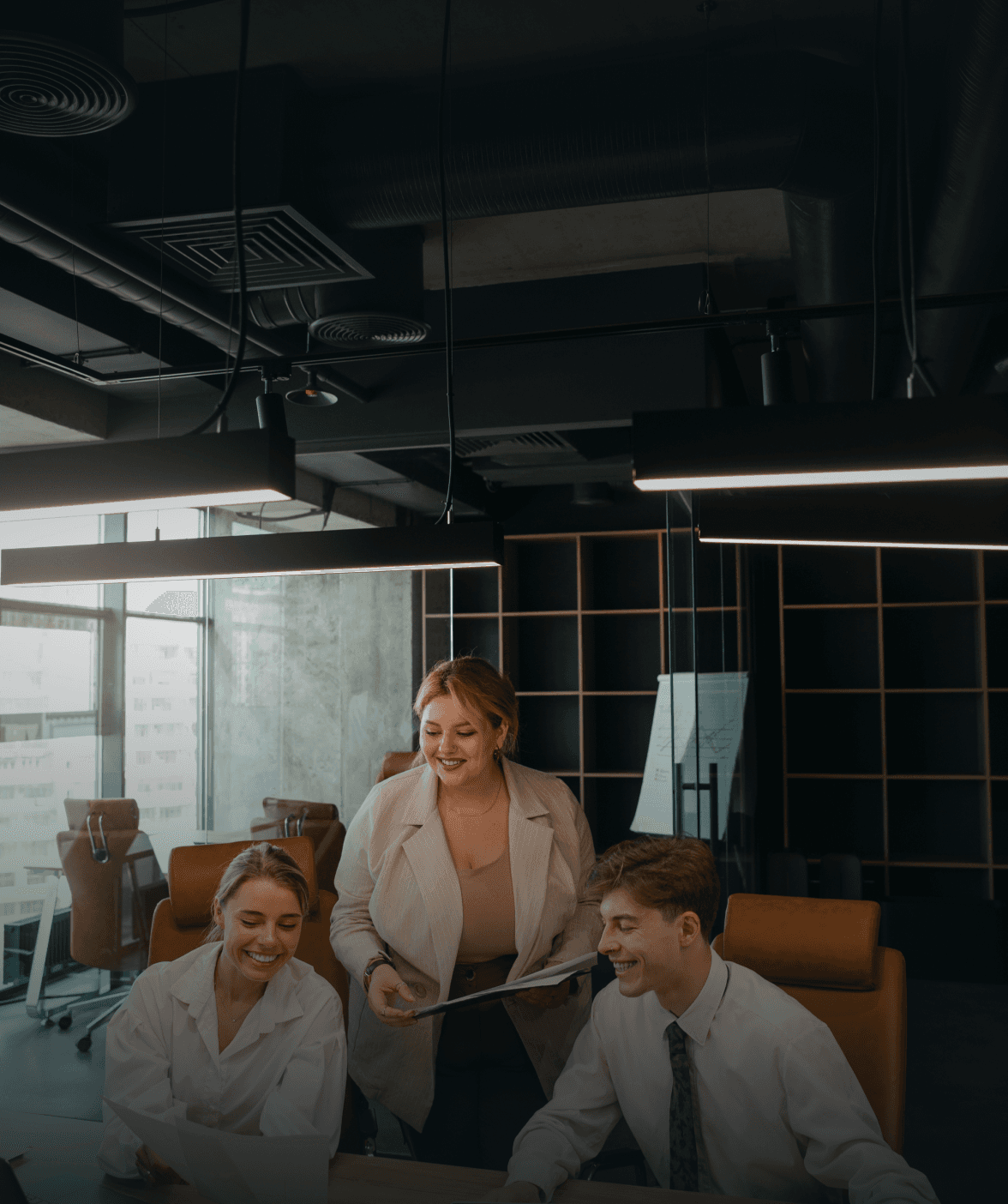 Image of office with 3 people