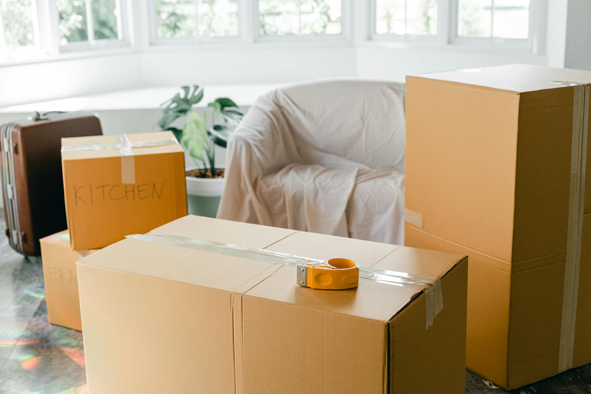 Moving boxes of different sizes laid on the floor