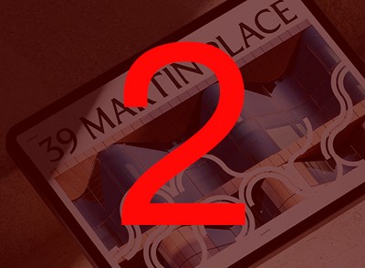 A person stands in a sandstone cave.