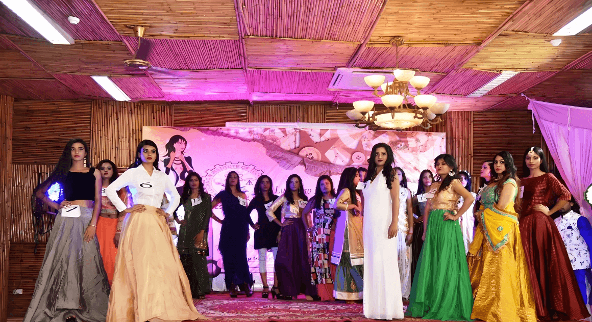 people sitting on chair in front of table while holding pens during daytime