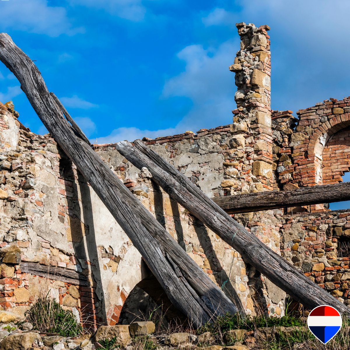 Old timber beams and stone walls to be rebuilt when restoring a house in the Tuscan Maremma