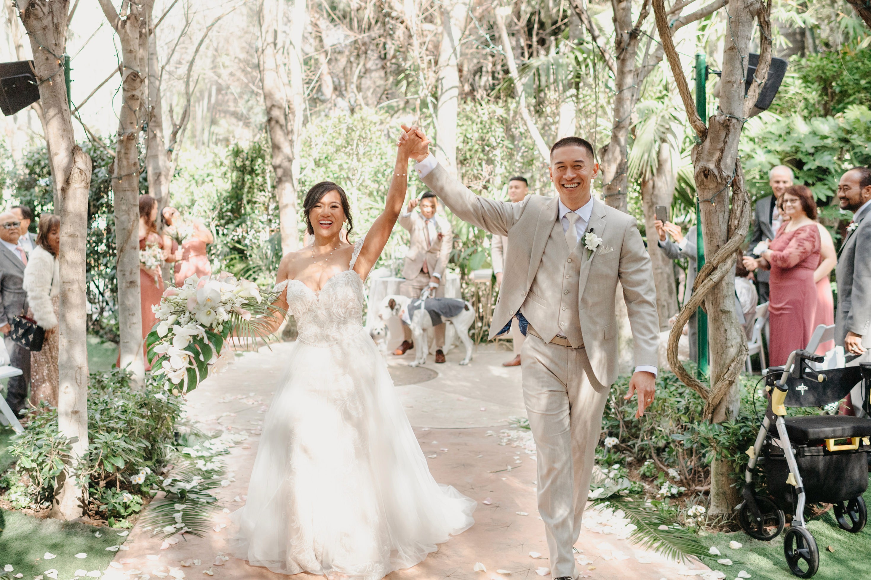 Flat lay wedding details with bouquet, rings, and sparkling bridal heels