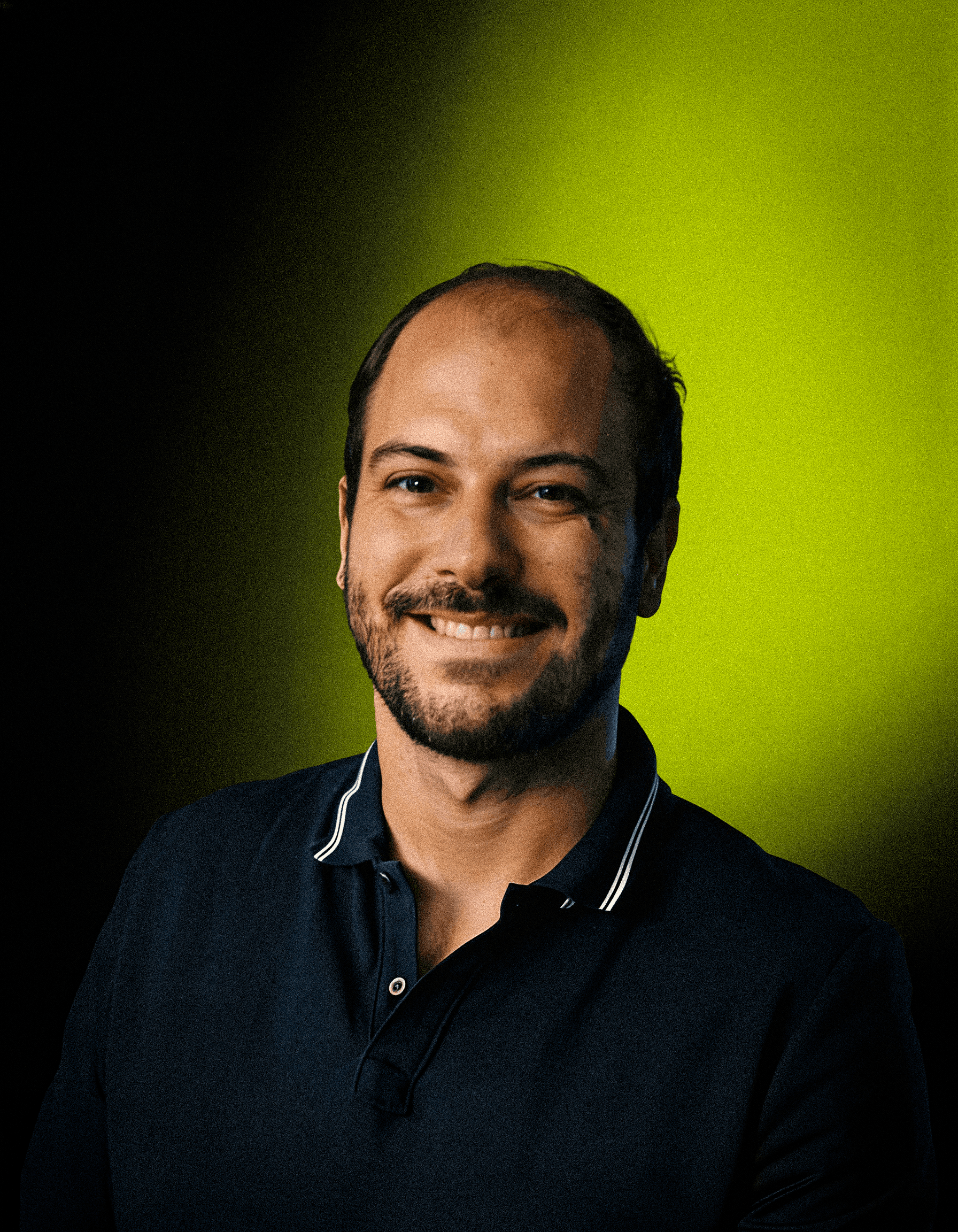 headshot of male in dark background