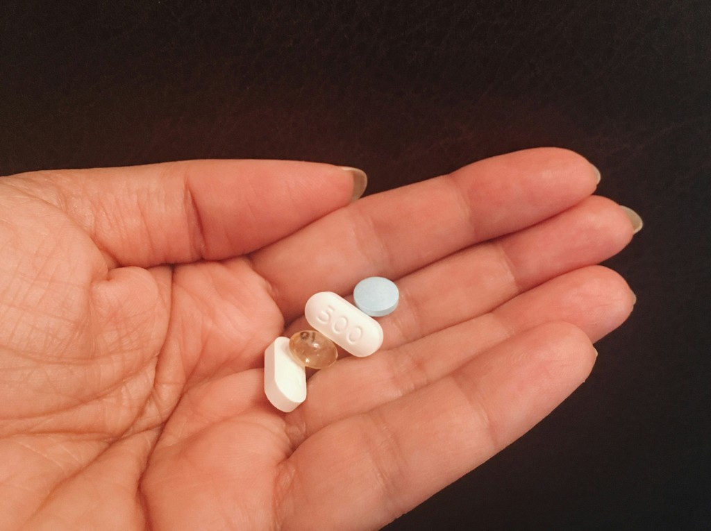 Person Holding some tablets