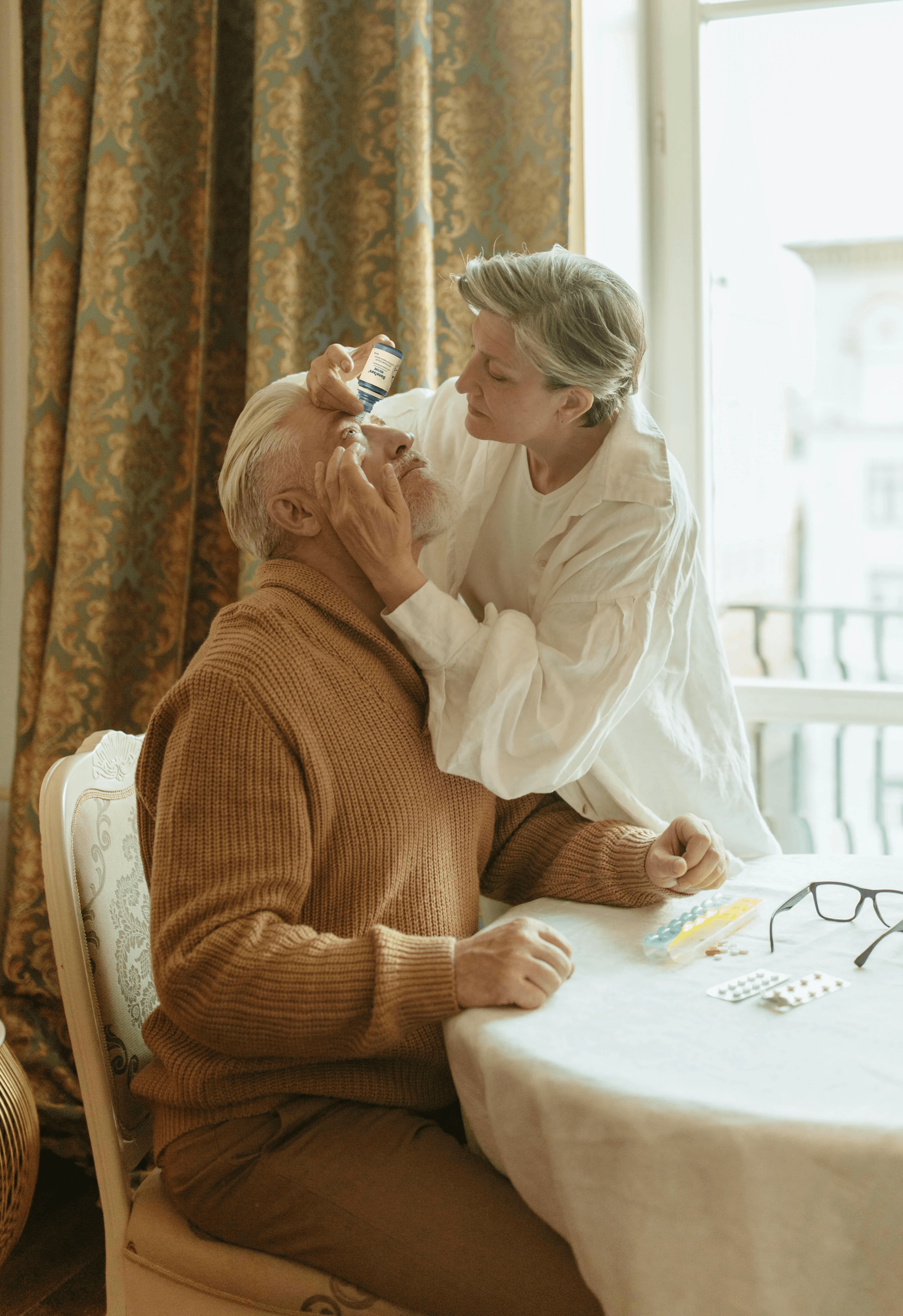 man with glasses smiling fully