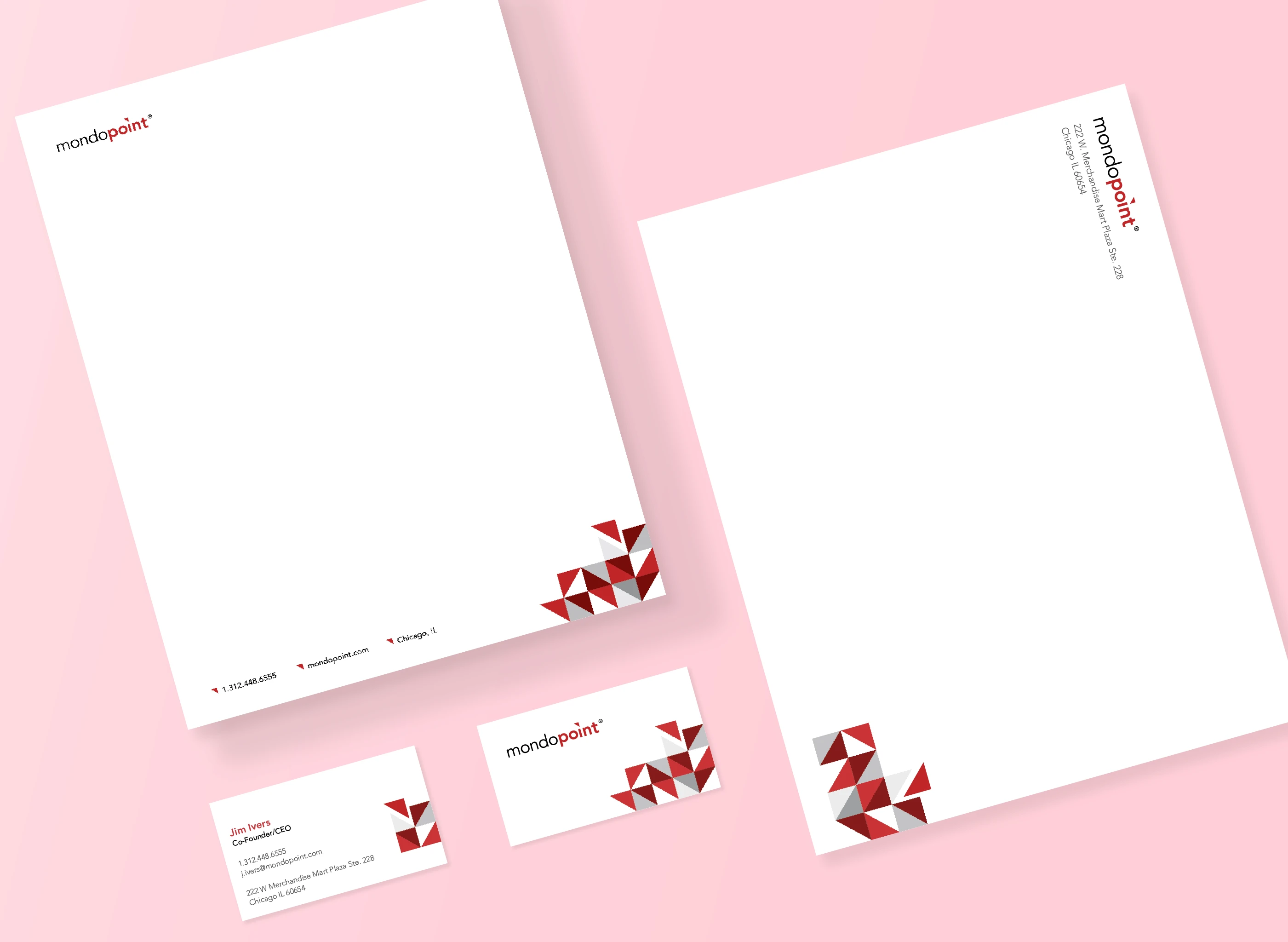 Display of Mondopoint stationary and business card design with revised idenity mark.