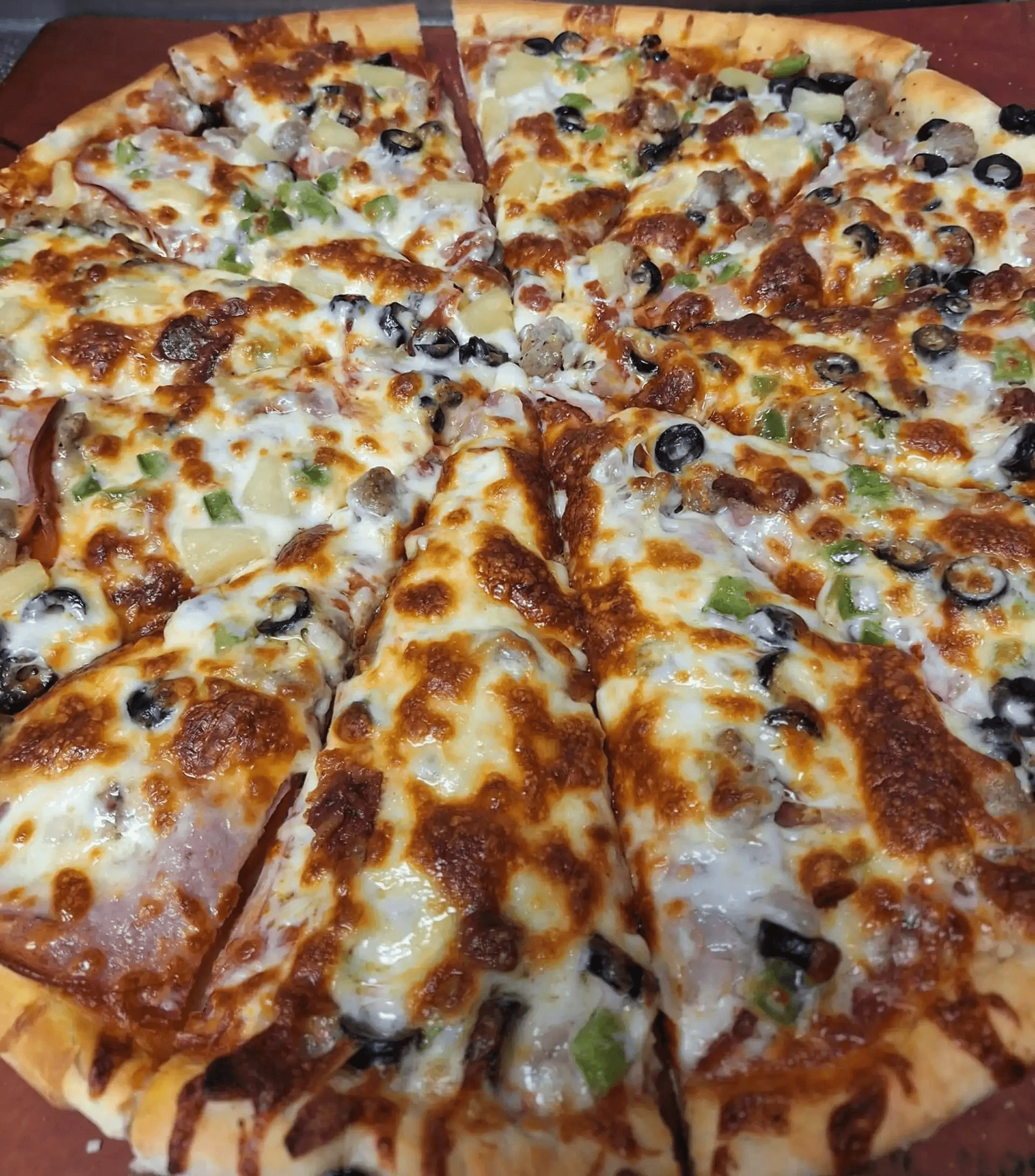 Flathead Lake Monster (Local Favorite) One Size really does FIT ALL! This Cove Favorite is the only pizza that comes in 18" on the Menu! Loaded with Canadian Bacon, Pepperoni, Italian Sausage, Bacon Pieces, Green Pepper, Red Onion, Black Olives, Pineapple, and a WHOPPING 1.5 Pounds of Cheese!